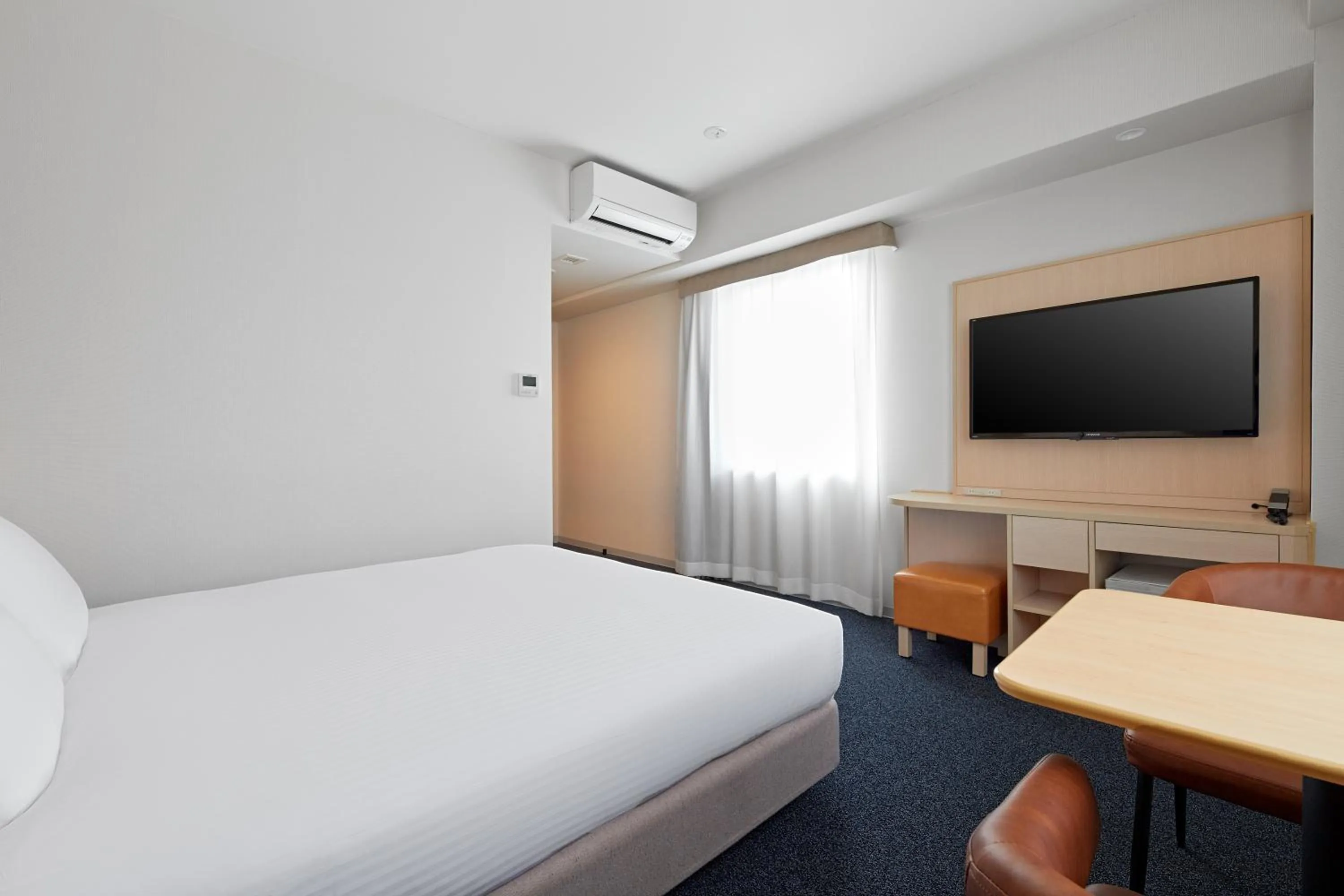 Bed in Sotetsu Fresa Inn Kyoto-Shijokarasuma