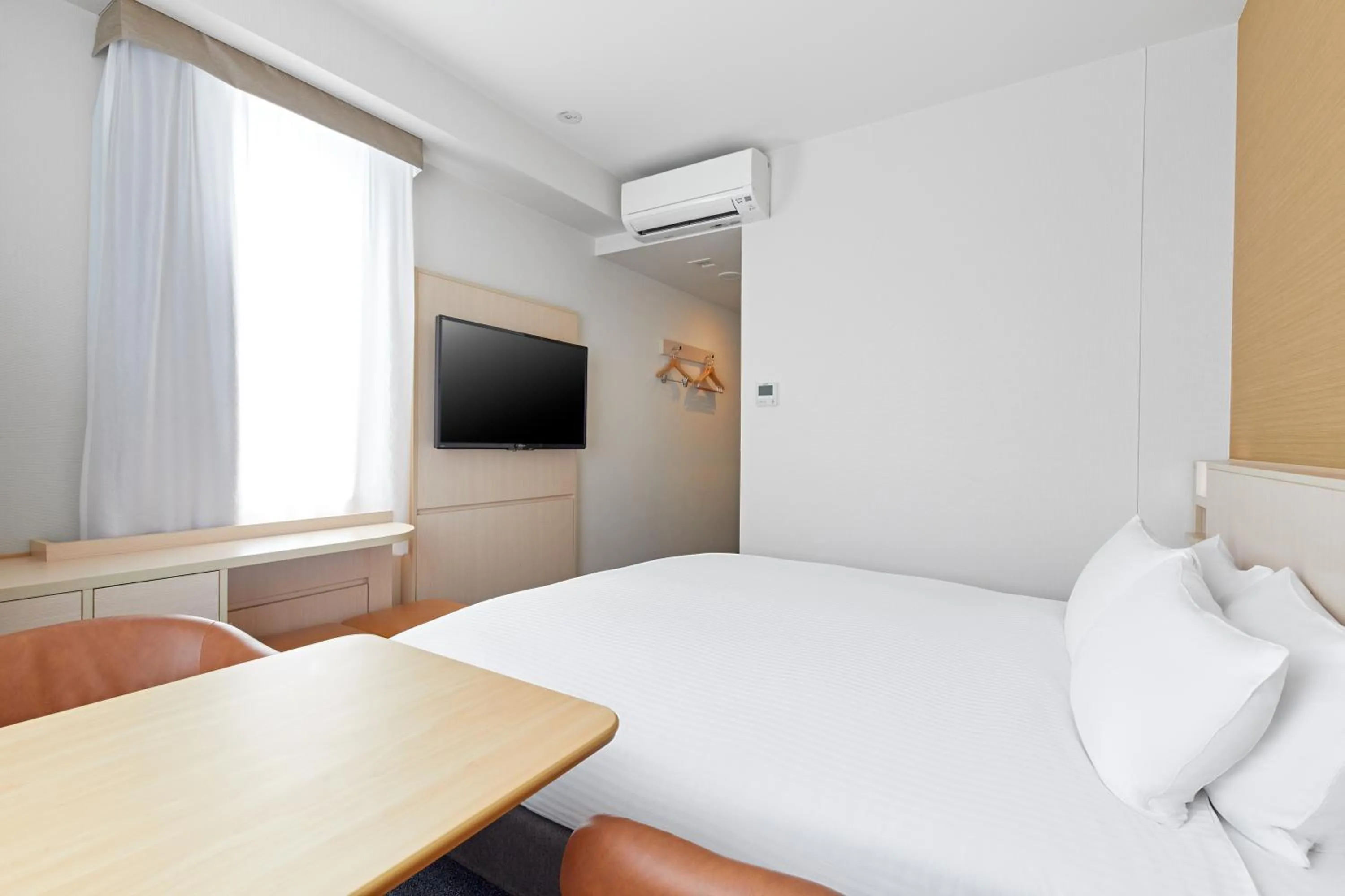 Bed in Sotetsu Fresa Inn Kyoto-Shijokarasuma