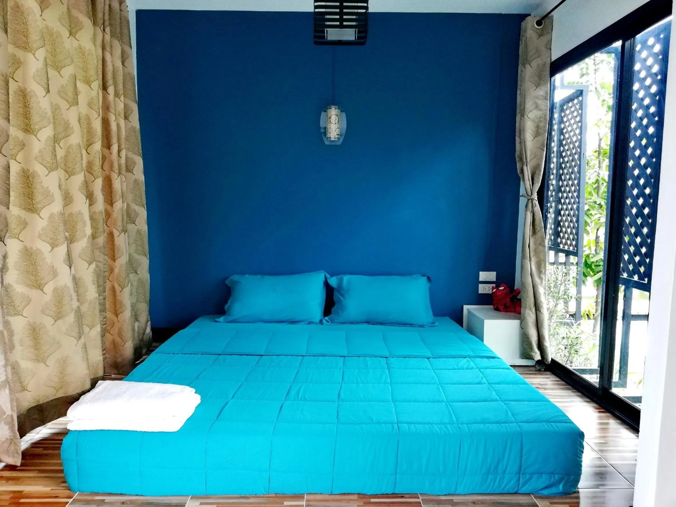 Bed in T'Luck House Resort