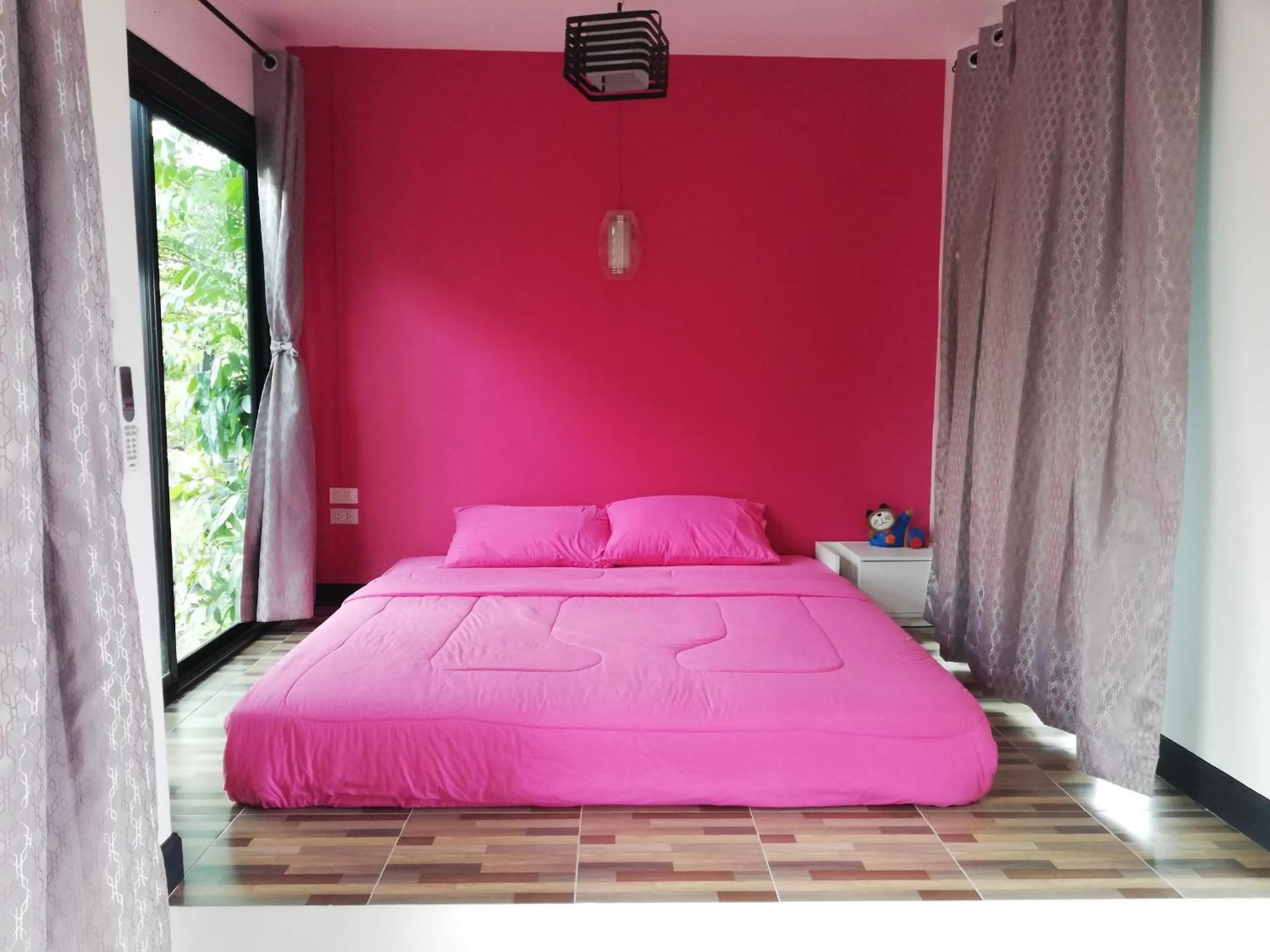 Bed in T'Luck House Resort