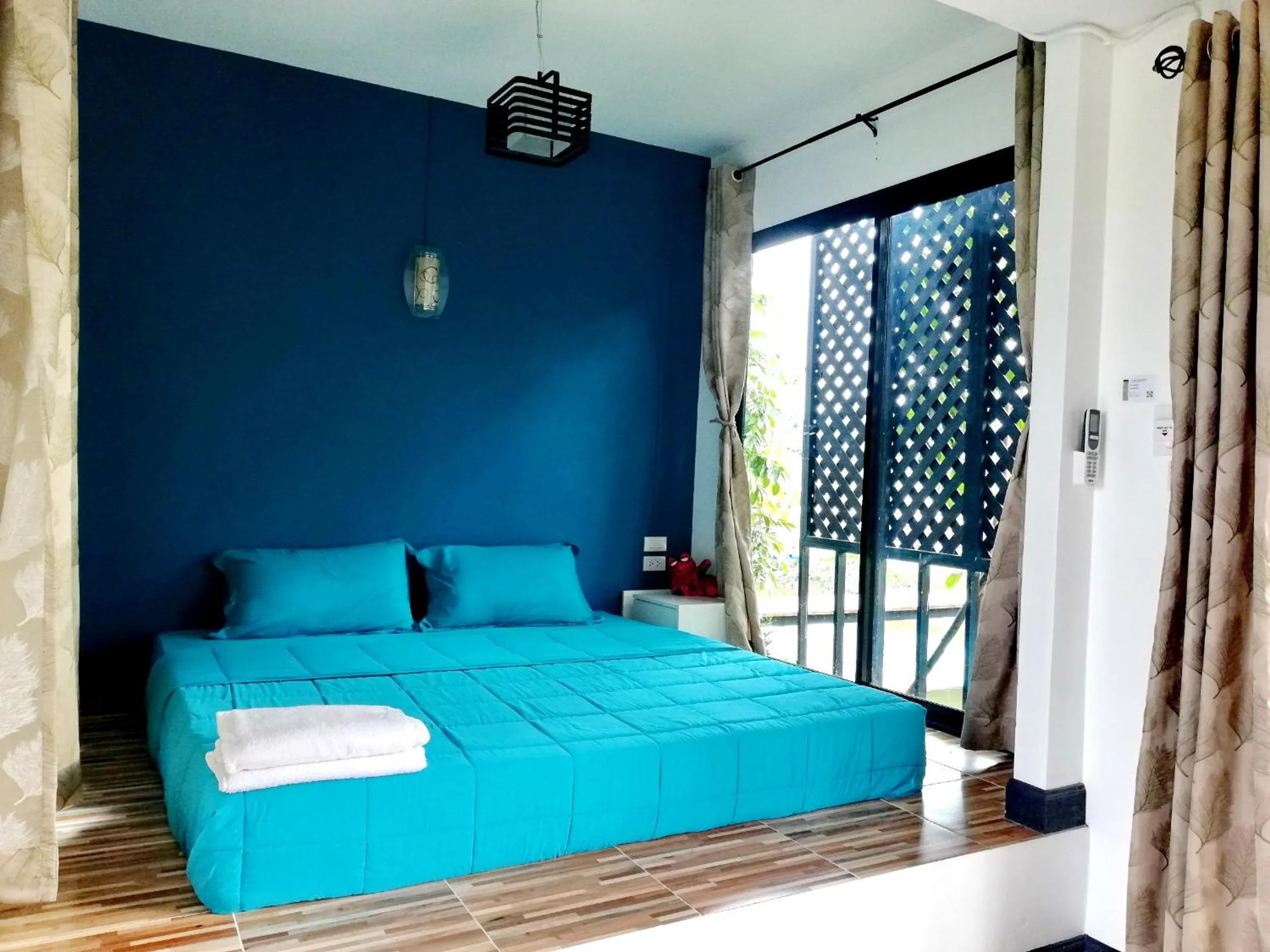 Bed in T'Luck House Resort