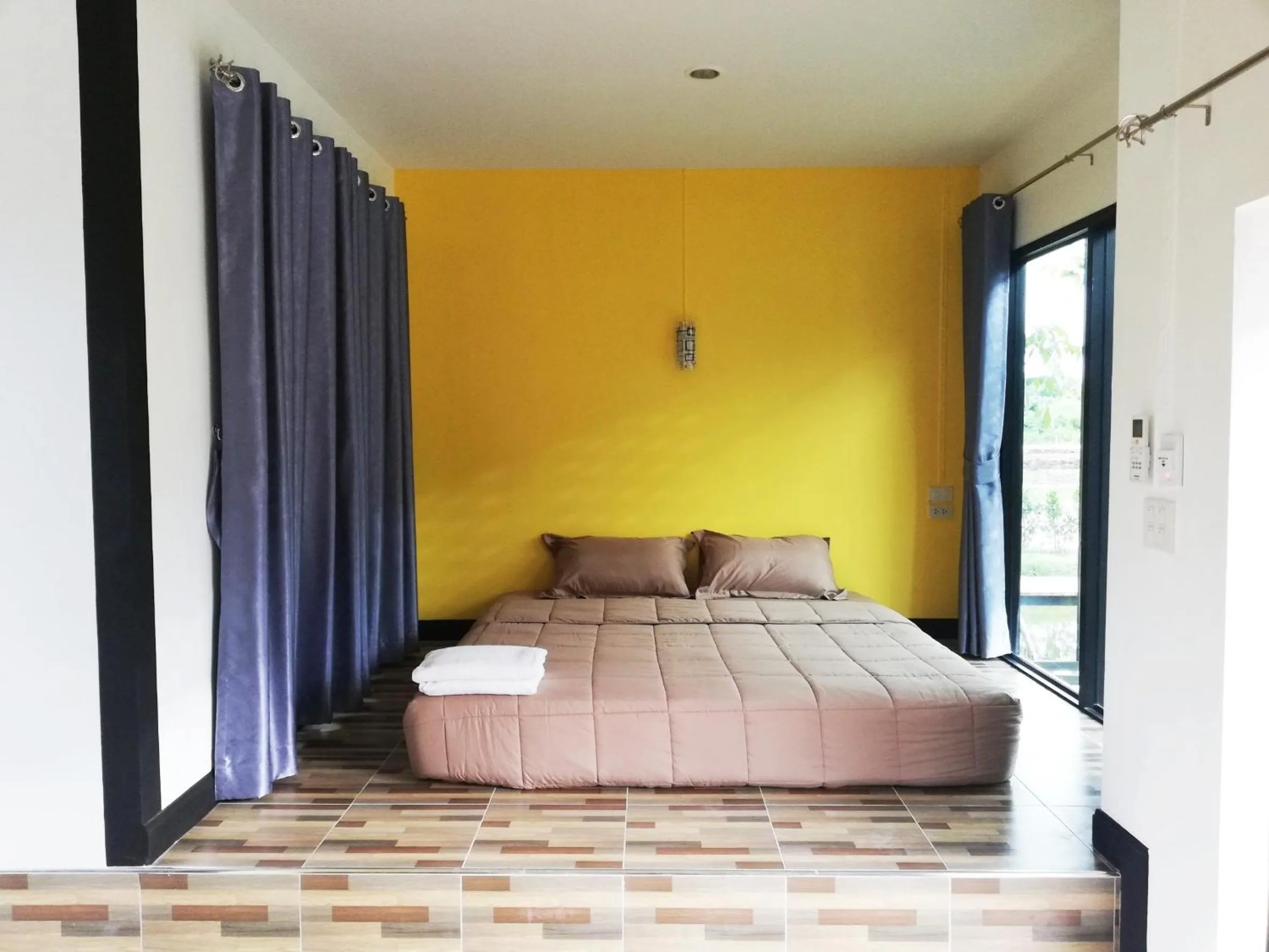 Bed in T'Luck House Resort