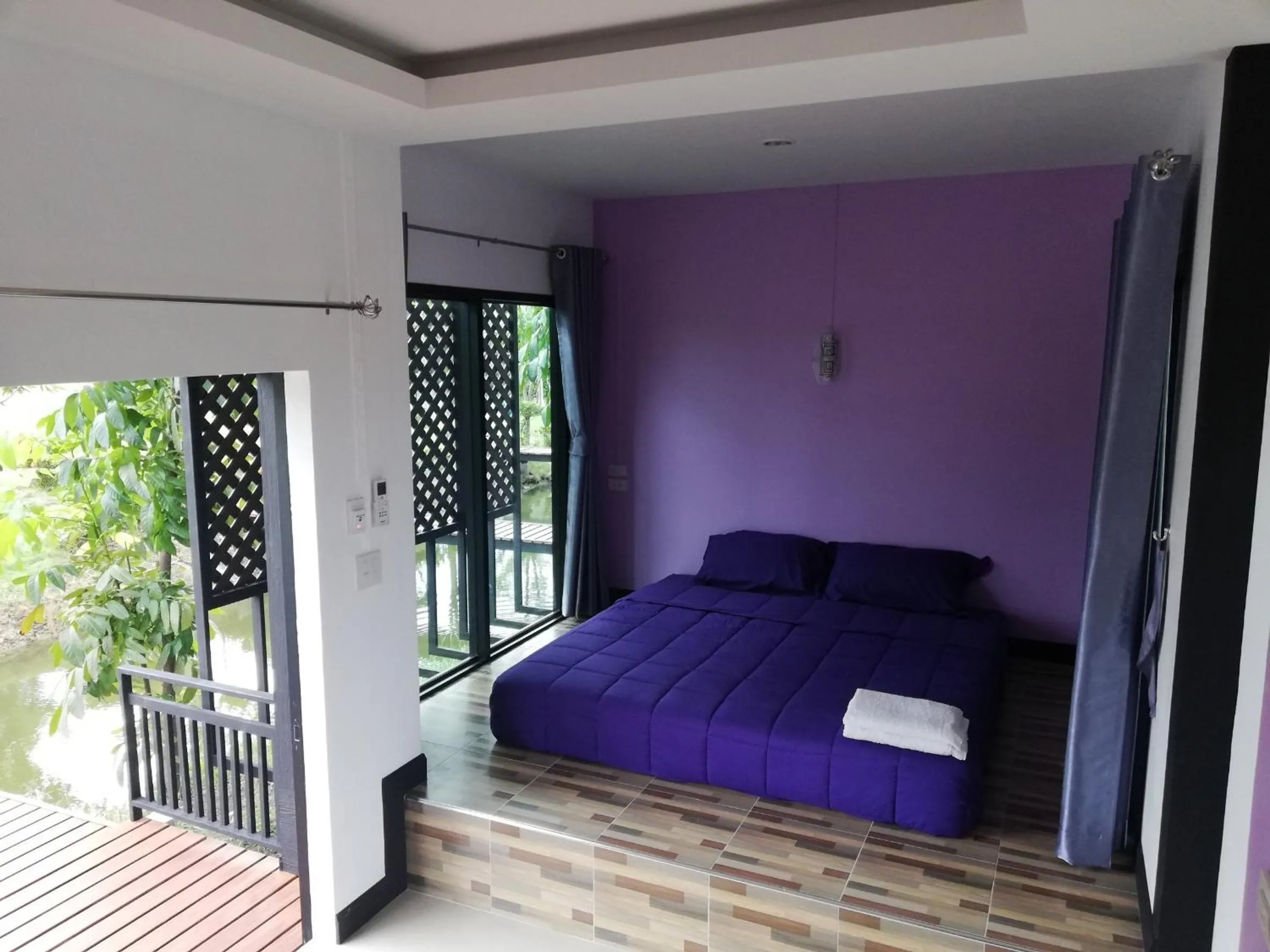 Bed in T'Luck House Resort