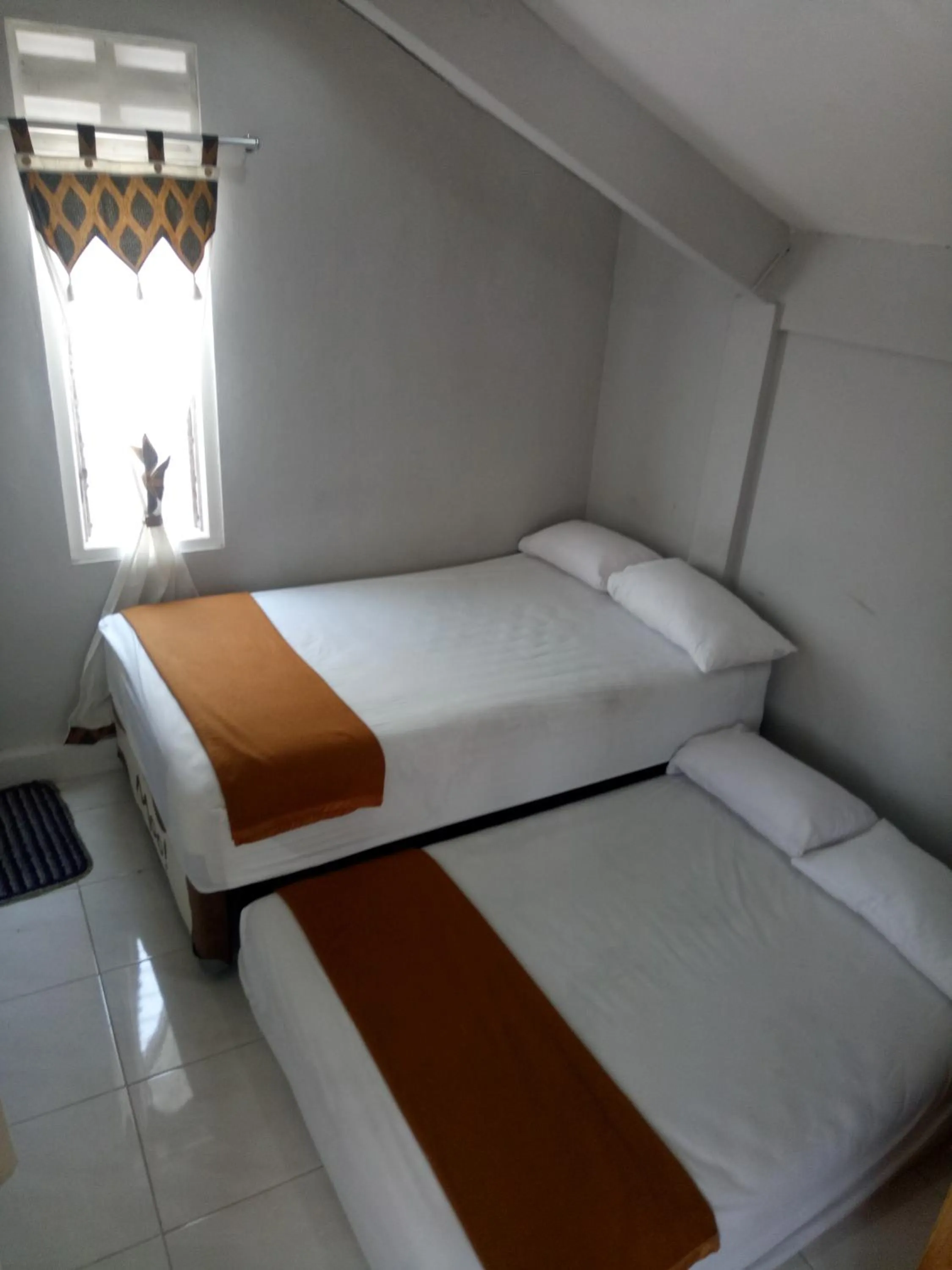 Bed in Losmen Fadel Malioboro Jogja