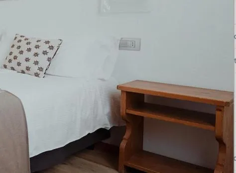 Bed in Hotel Albergo Dolomiti