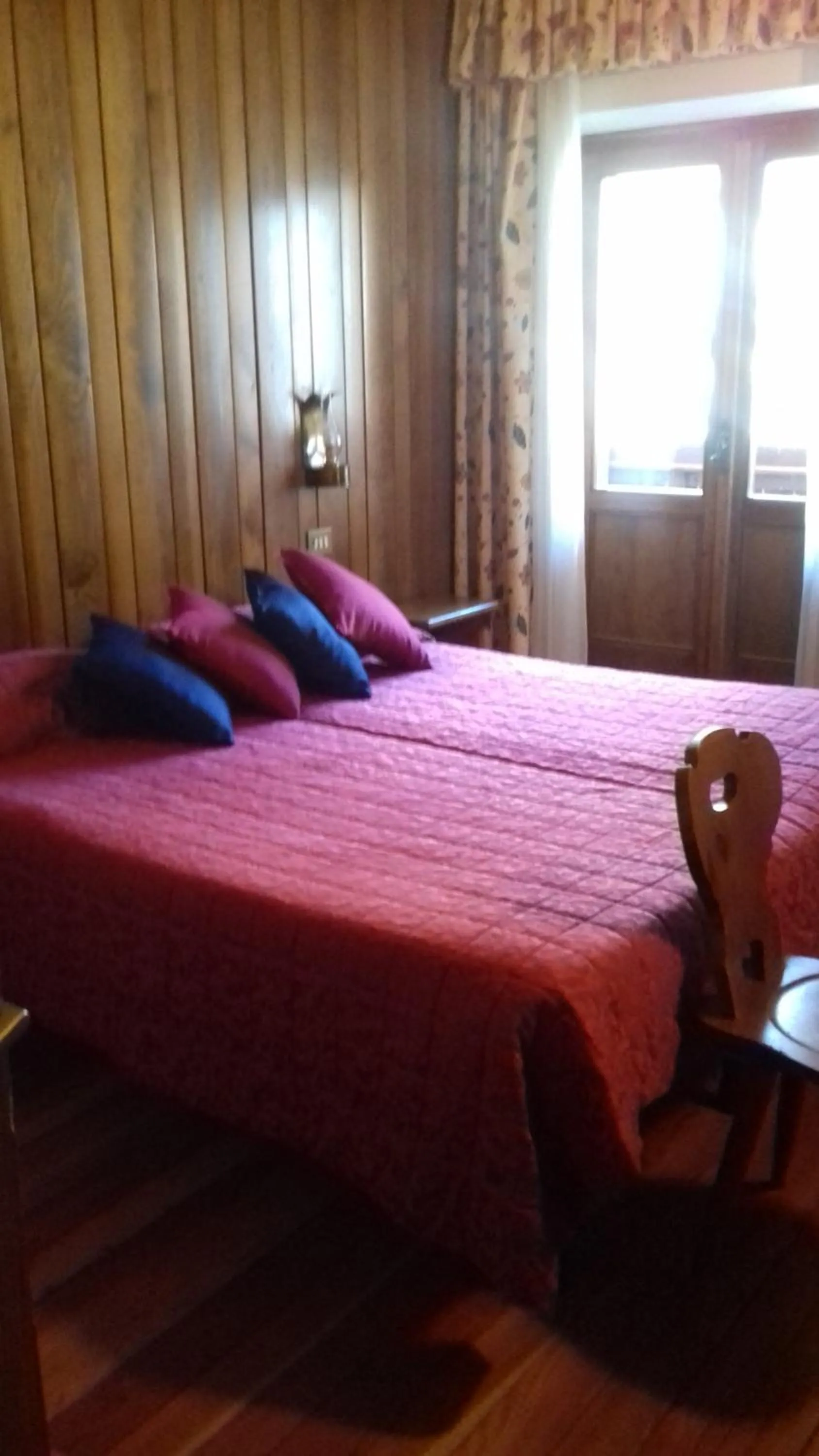 Bed in Hotel Albergo Dolomiti