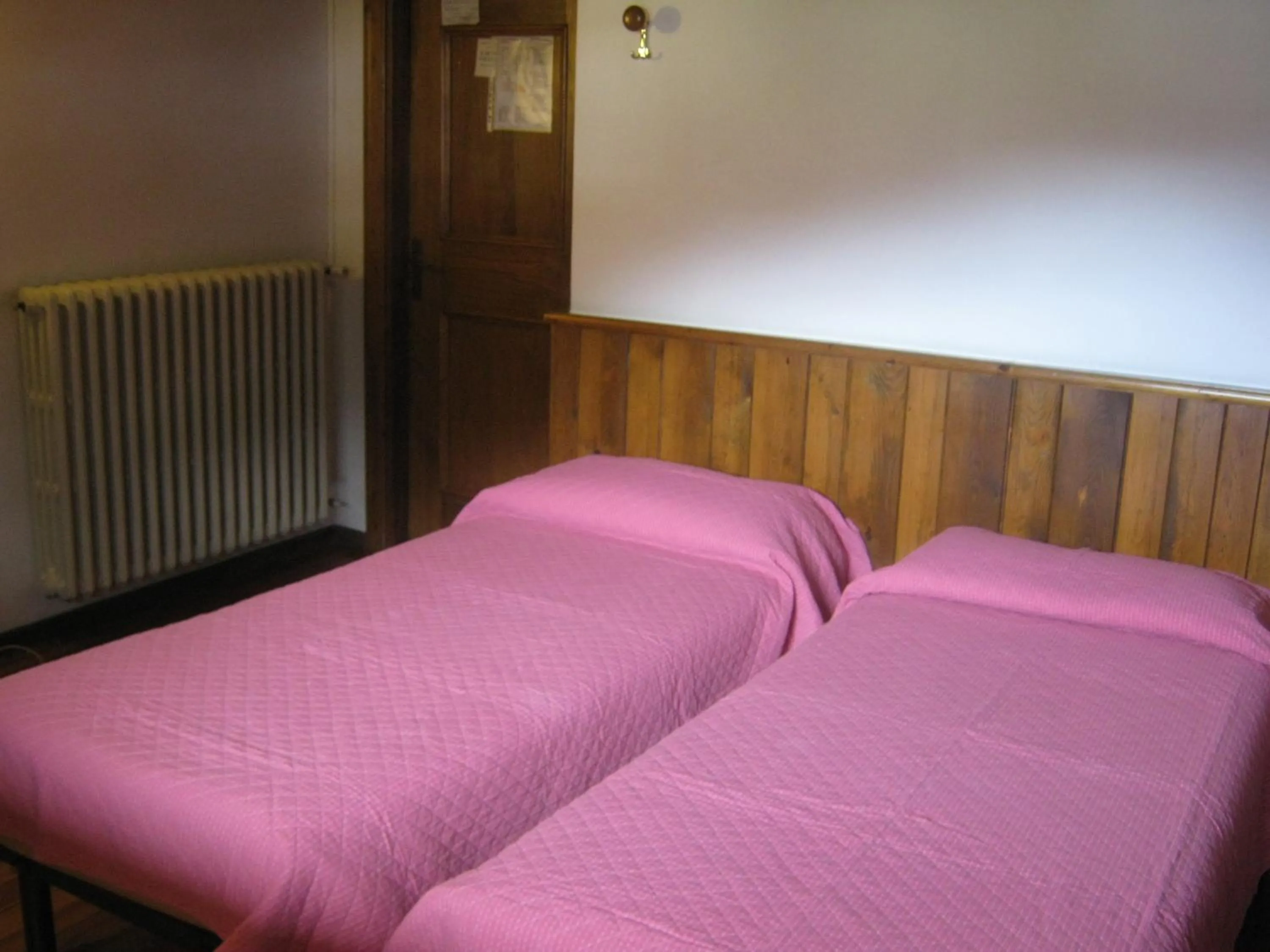 Bed in Hotel Albergo Dolomiti