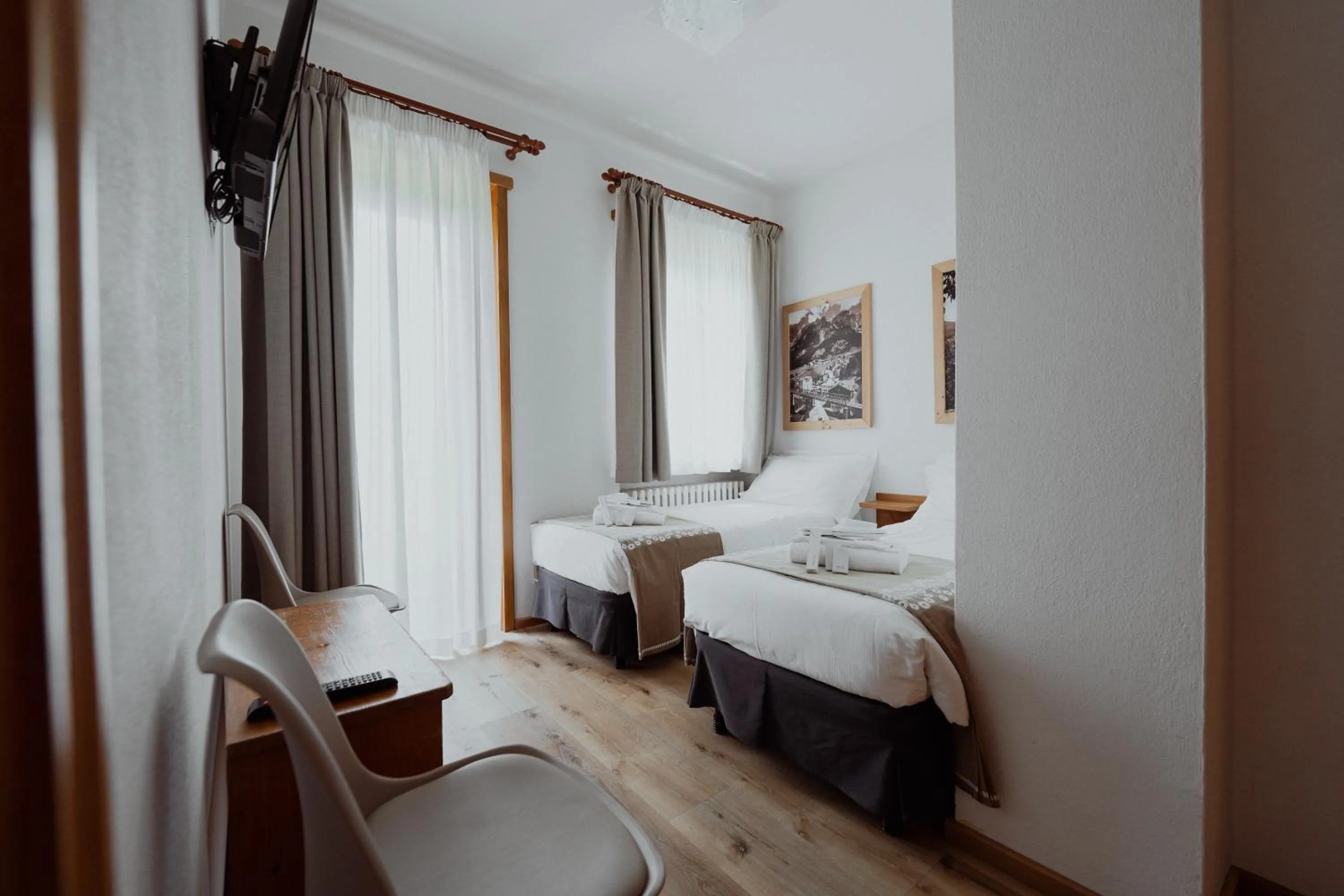 Bed in Hotel Albergo Dolomiti