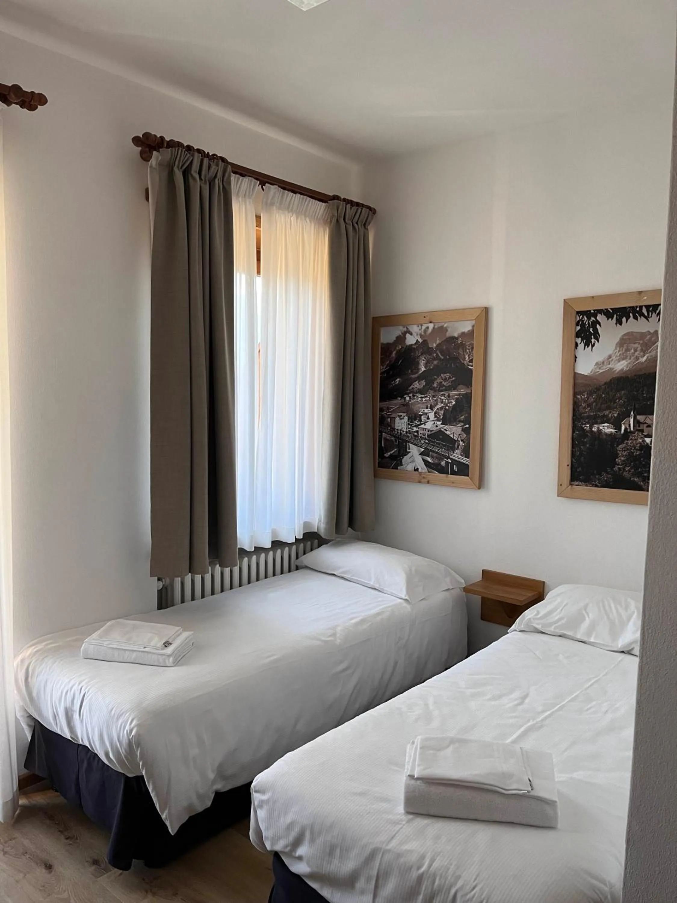 Bed in Hotel Albergo Dolomiti