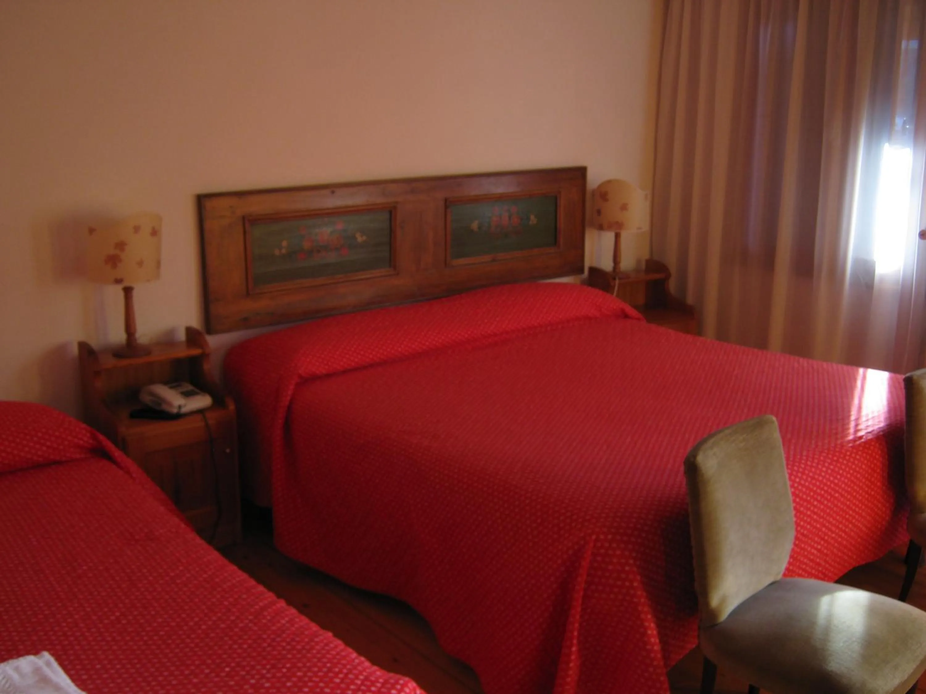 Bed in Hotel Albergo Dolomiti
