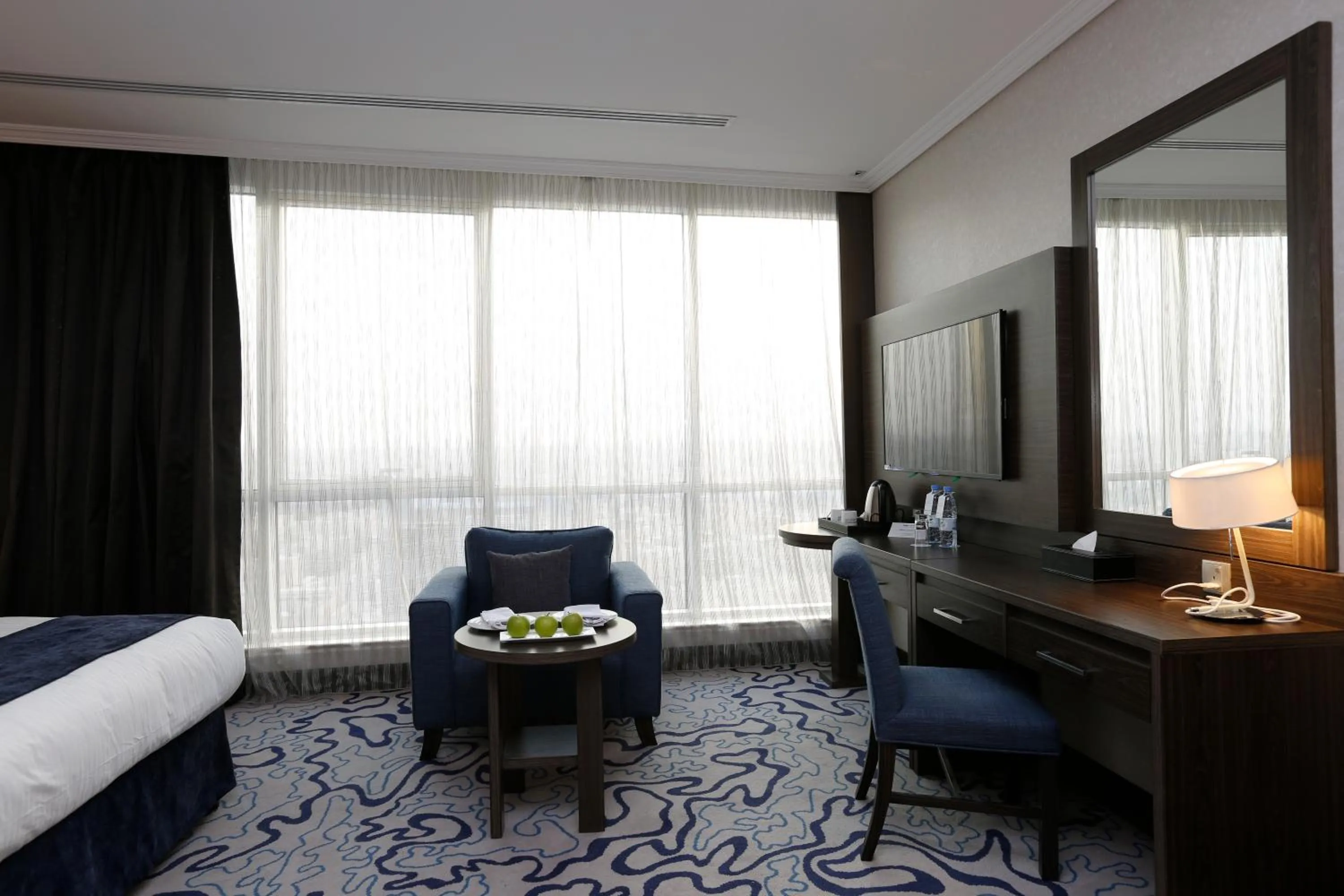 Seating area, Bed in Swiss Flora Royal Hotel Riyadh