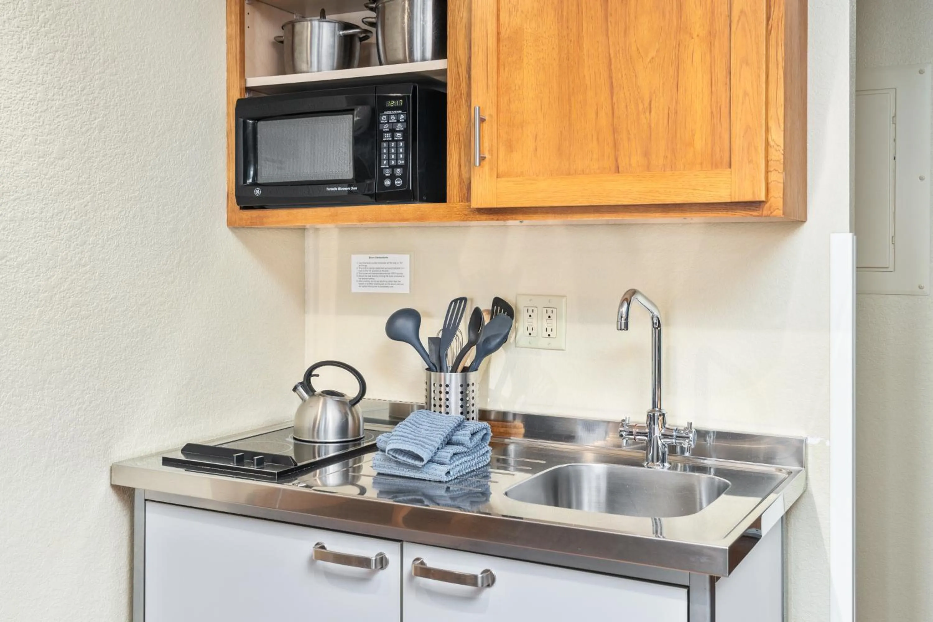 Kitchen or kitchenette in East Bay Suites