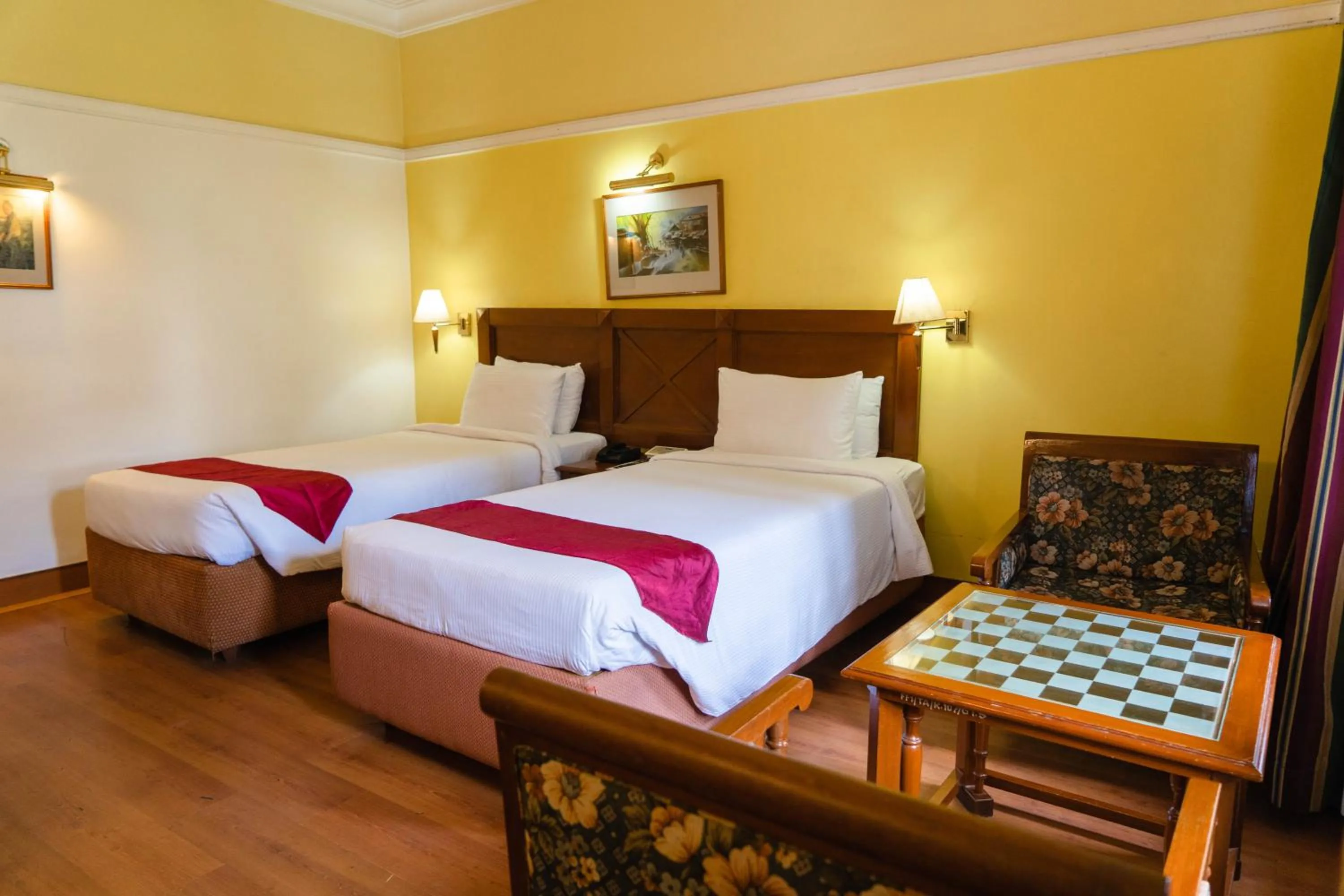 Bed in KTDC Mascot Hotel - A Heritage Living Experience
