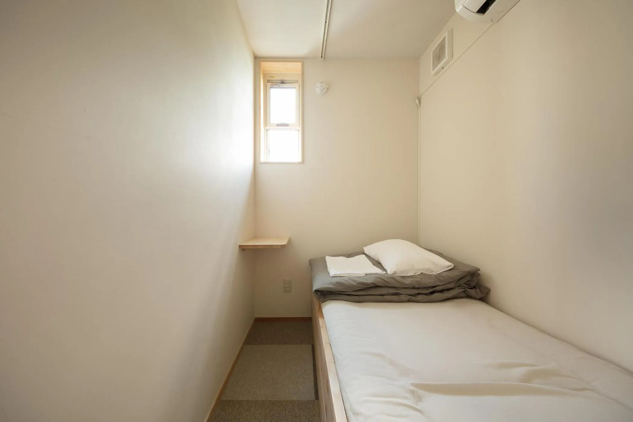 Bed in Sai no Tsuno Guest House