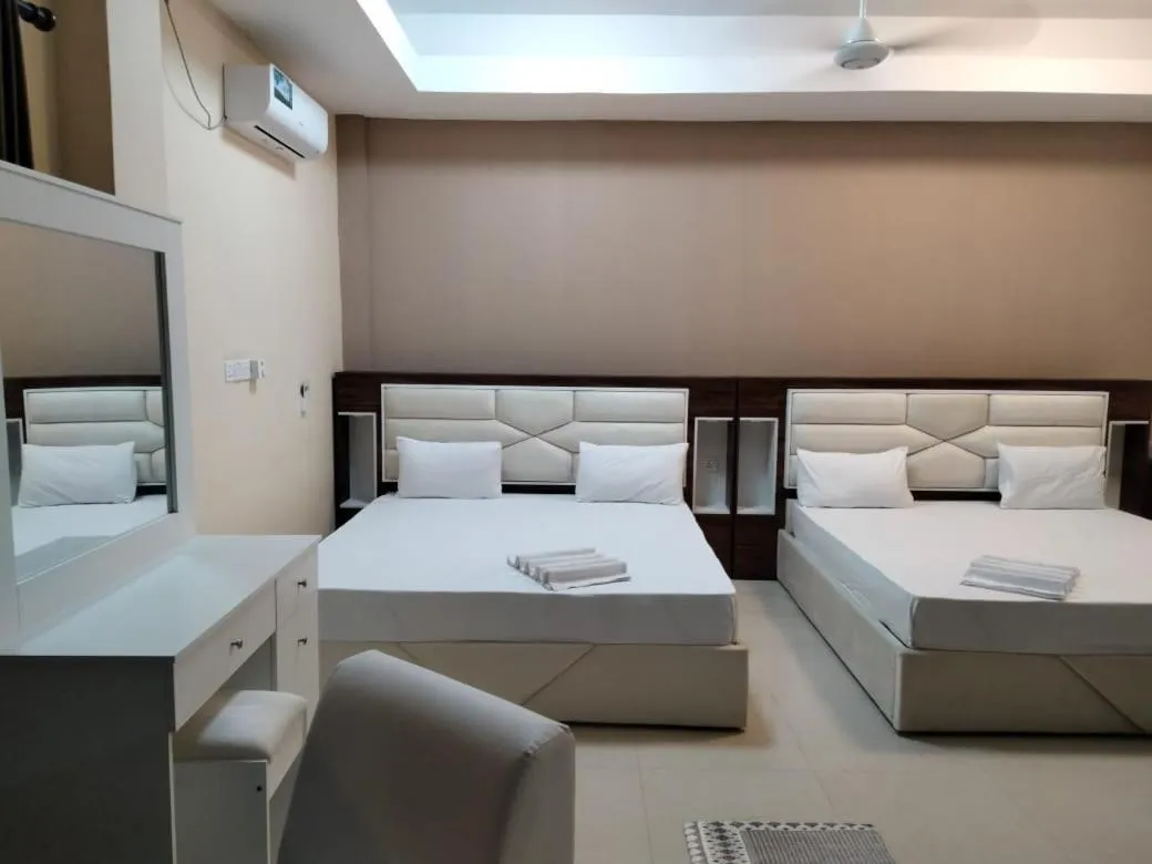 Bed in Gnaanams Hotel and Restaurant