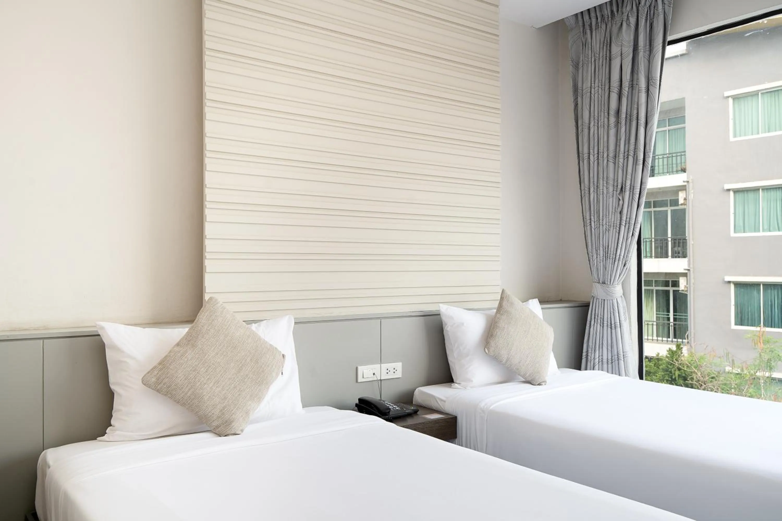 Bed in Leenova Hotel