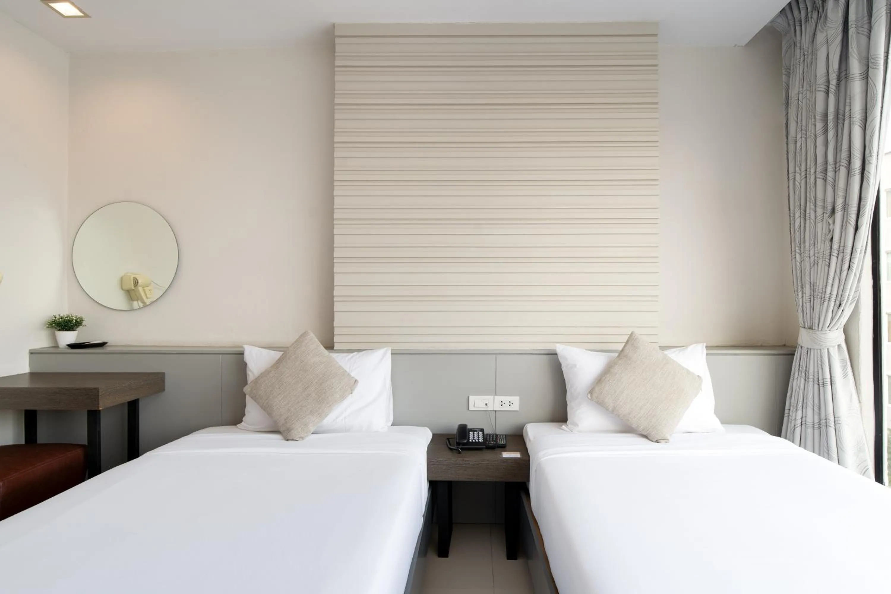 Bed in Leenova Hotel