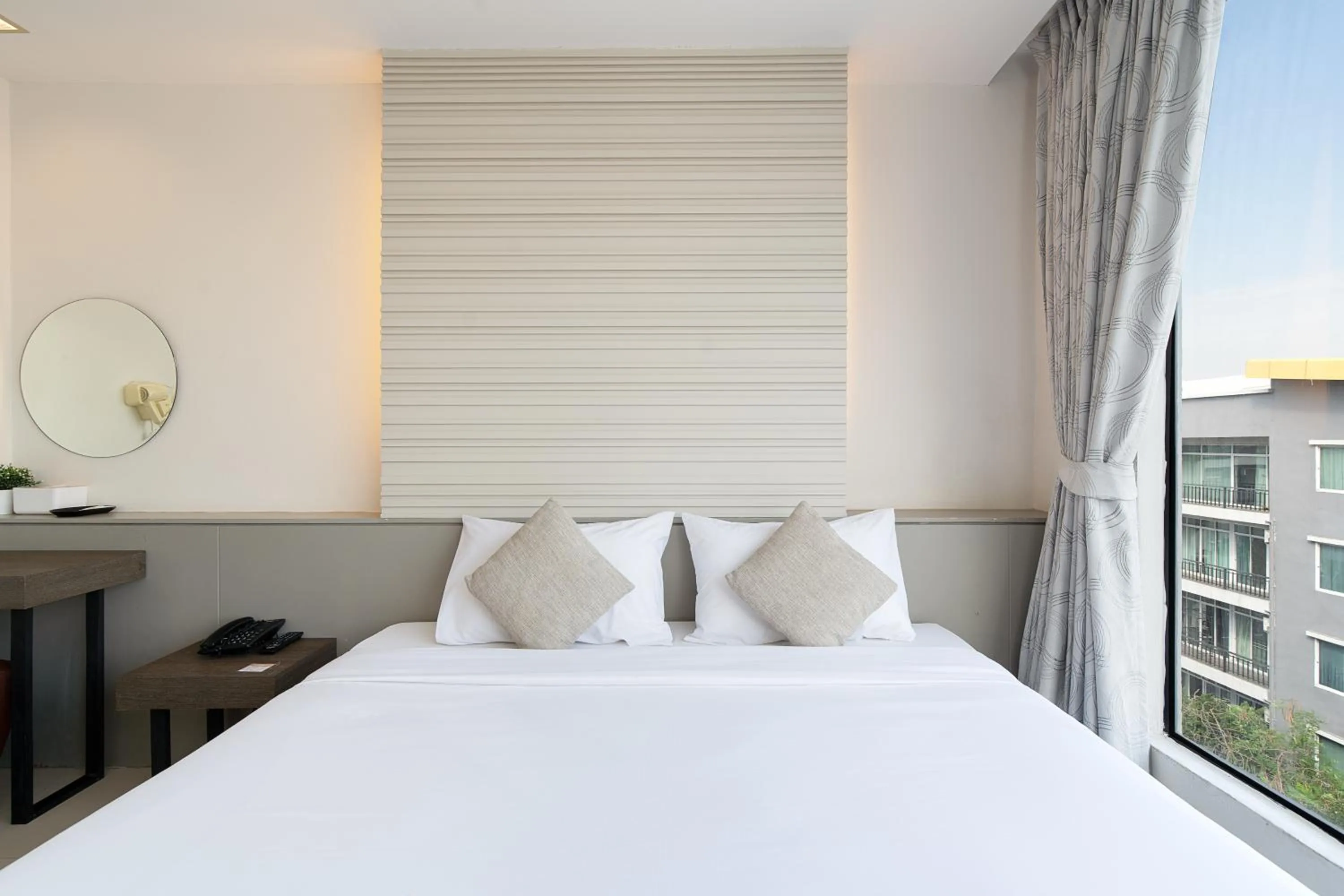 Bed in Leenova Hotel