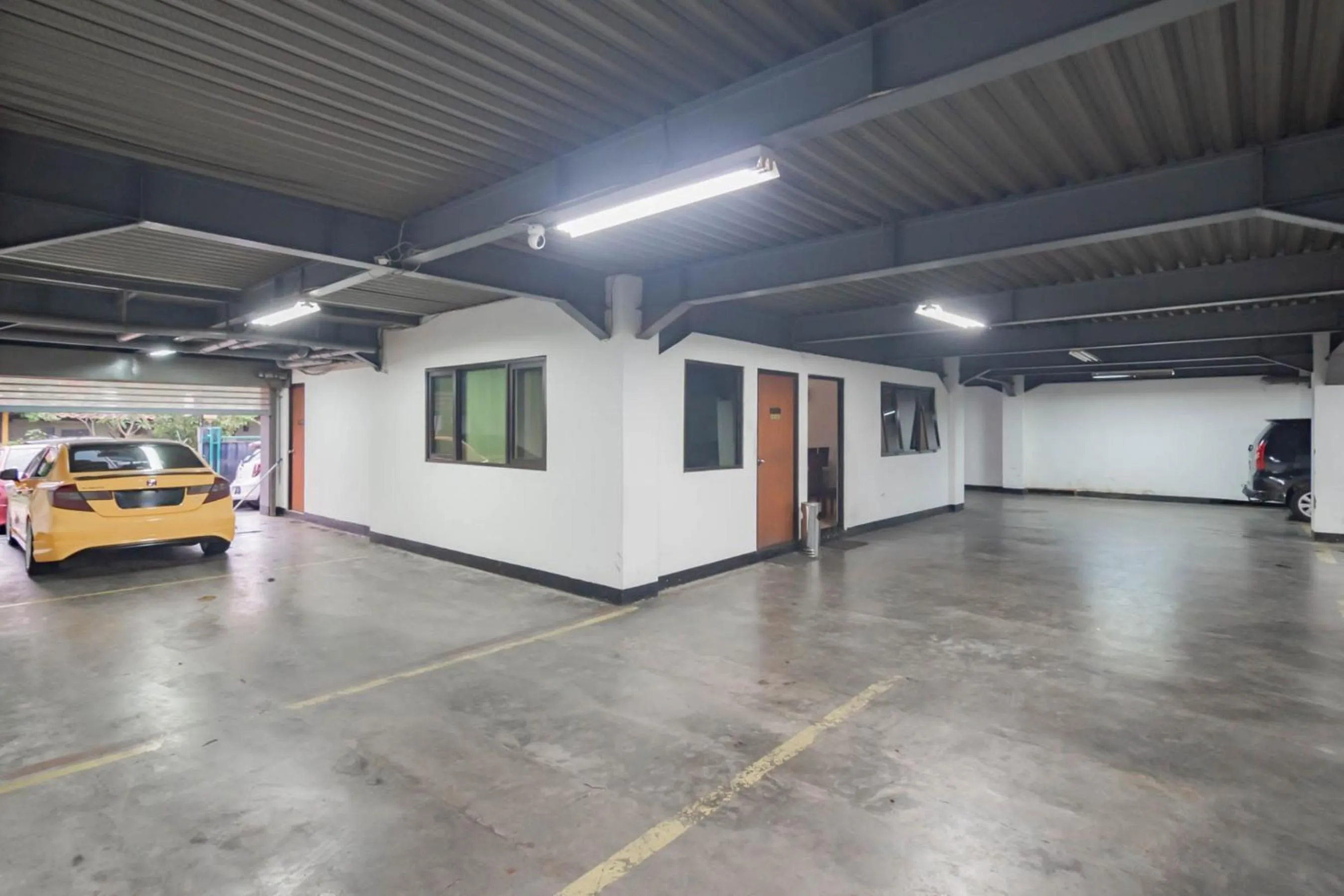 Parking in RedDoorz Plus at Buah Batu