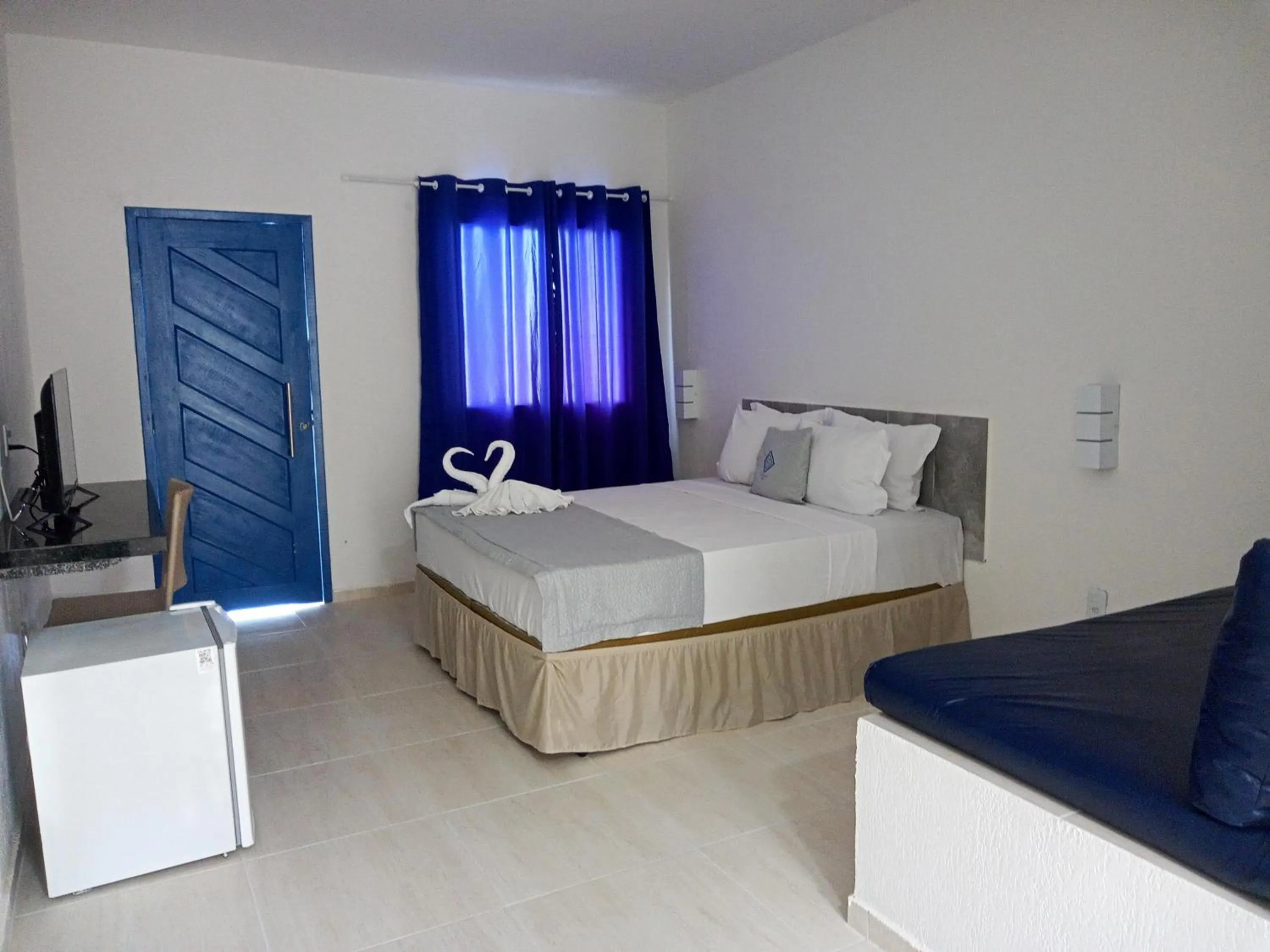 Photo of the whole room, Bed in La Suite Praia Hotel