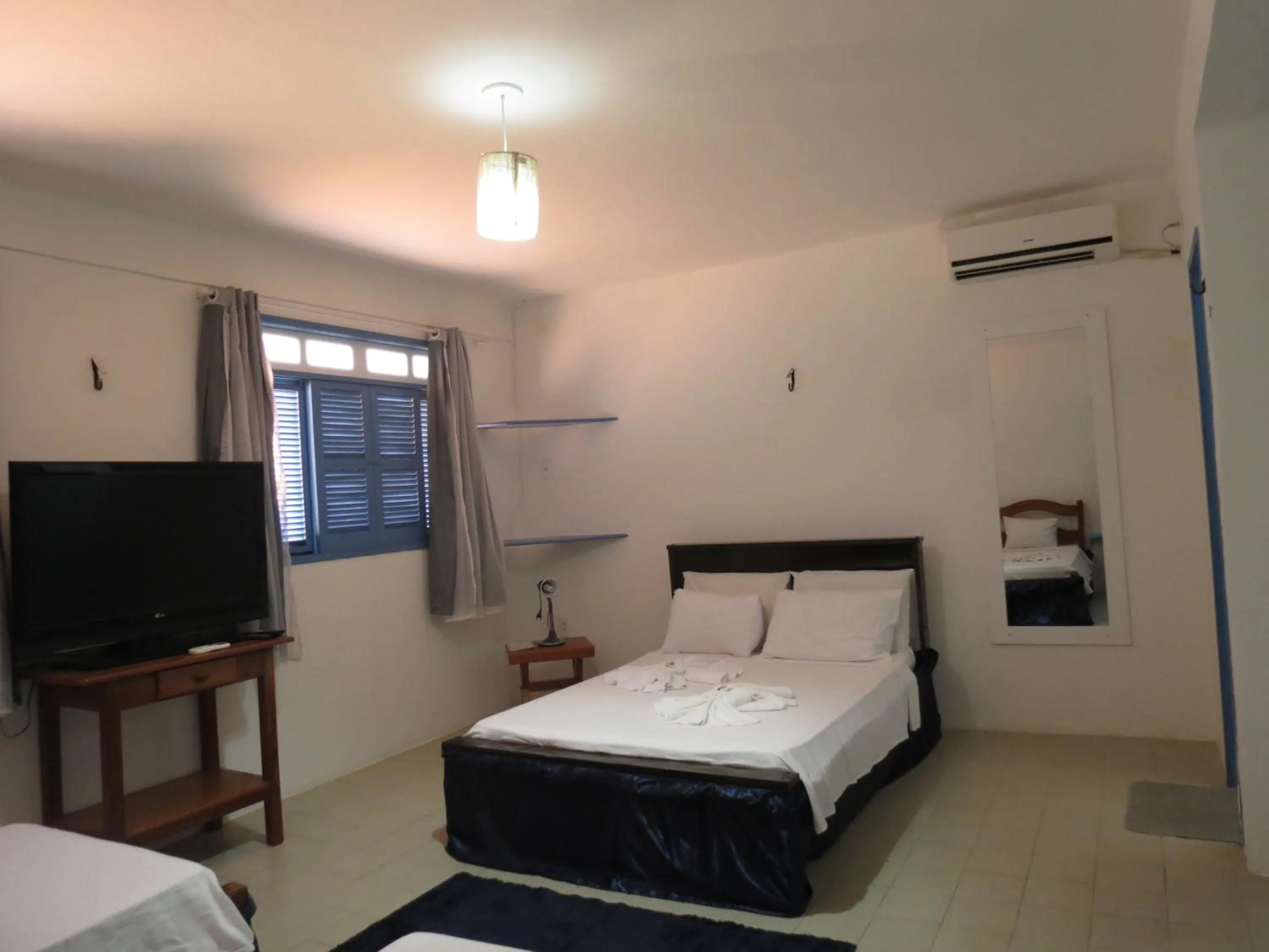 Photo of the whole room, Bed in La Suite Praia Hotel