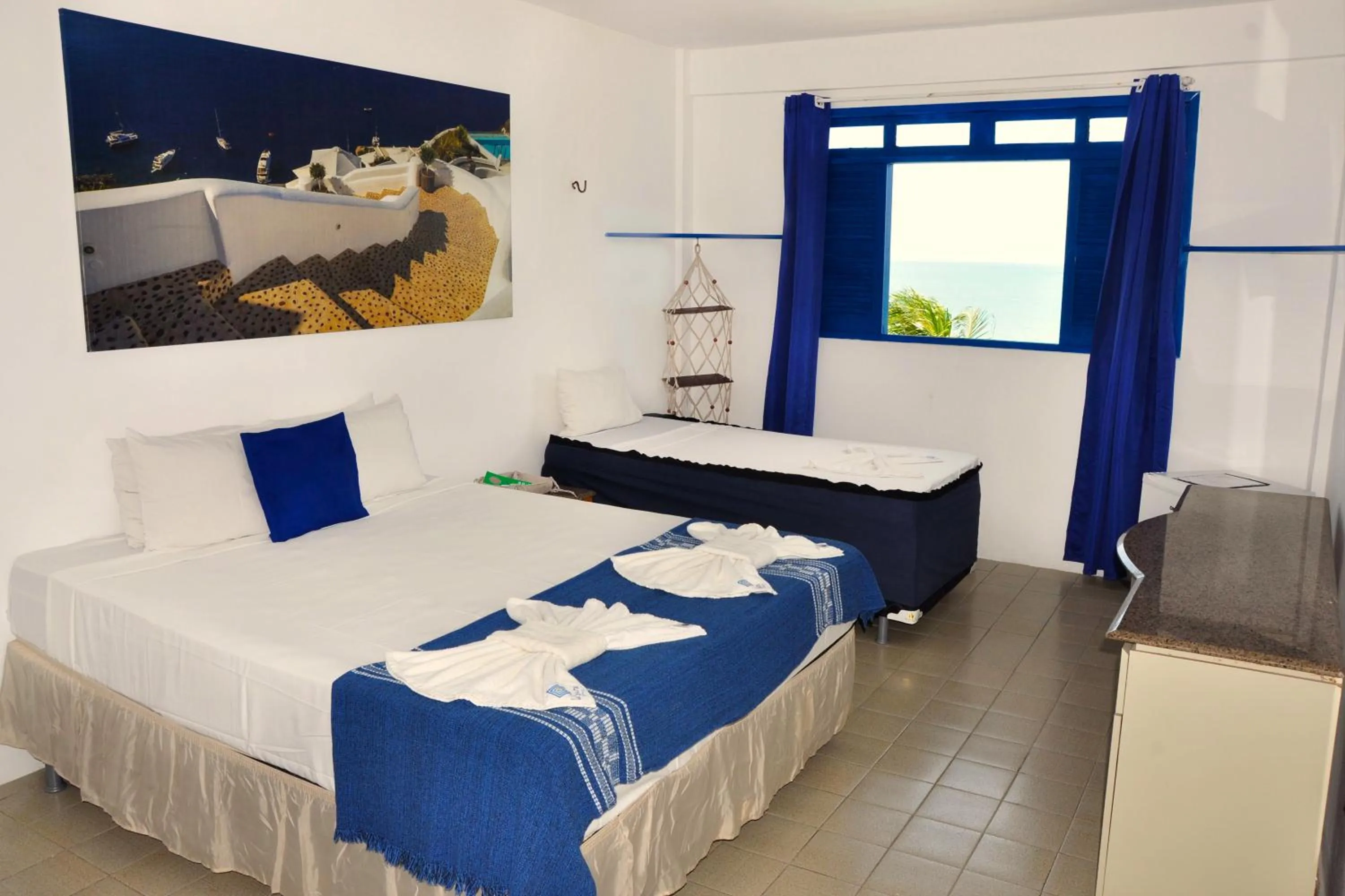 Bed in La Suite Praia Hotel