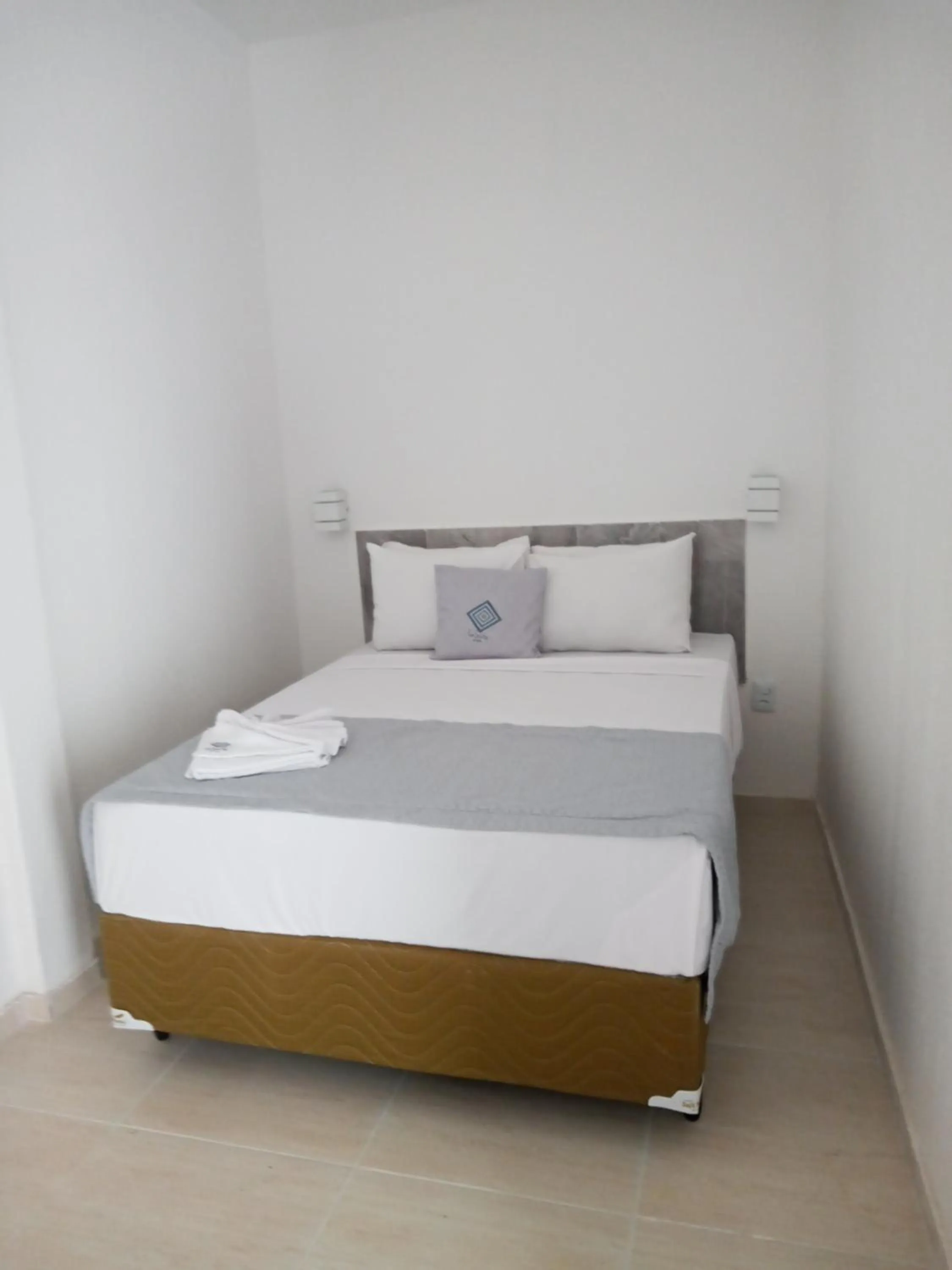 Bed in La Suite Praia Hotel