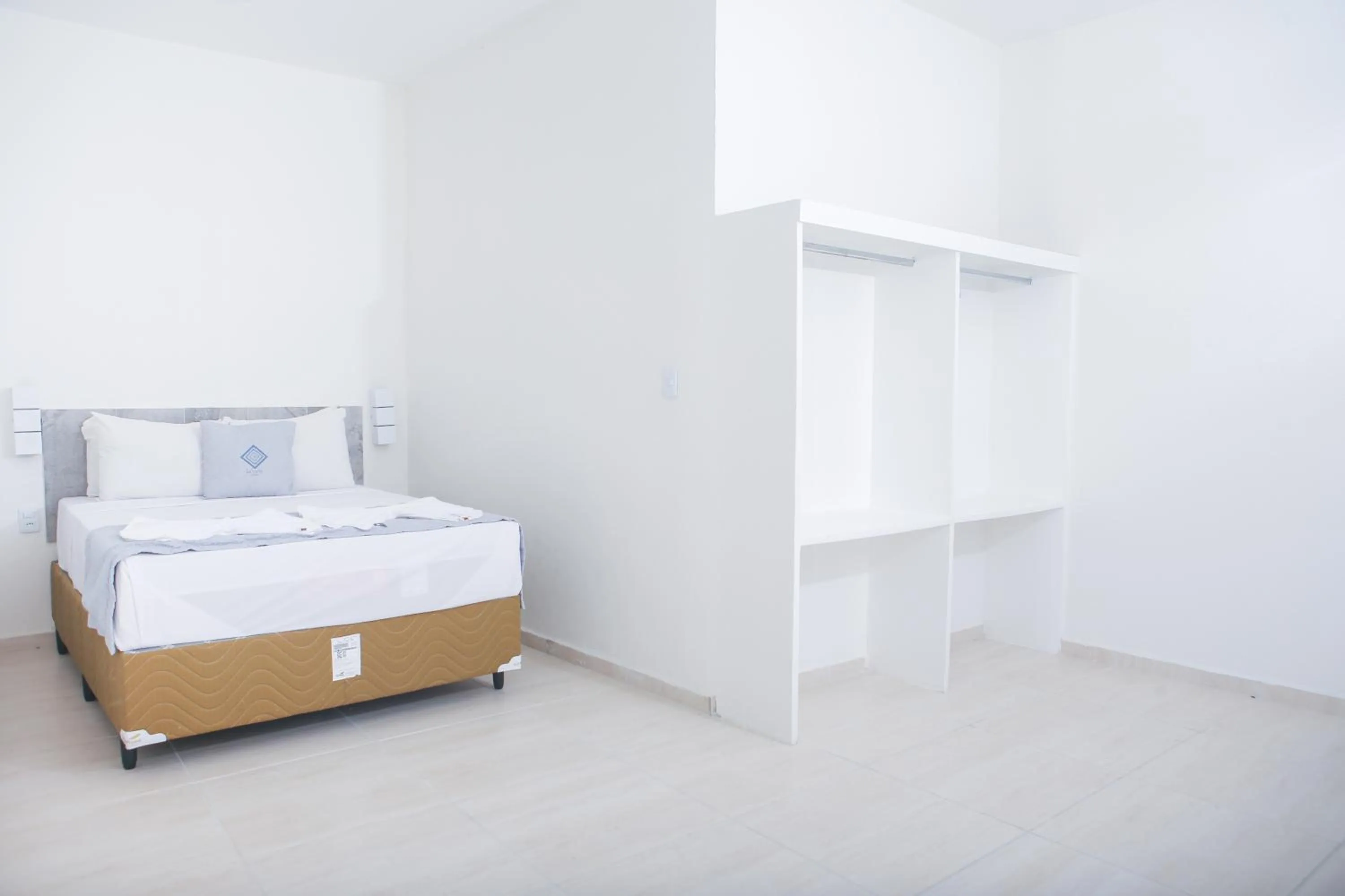 Photo of the whole room, Bed in La Suite Praia Hotel