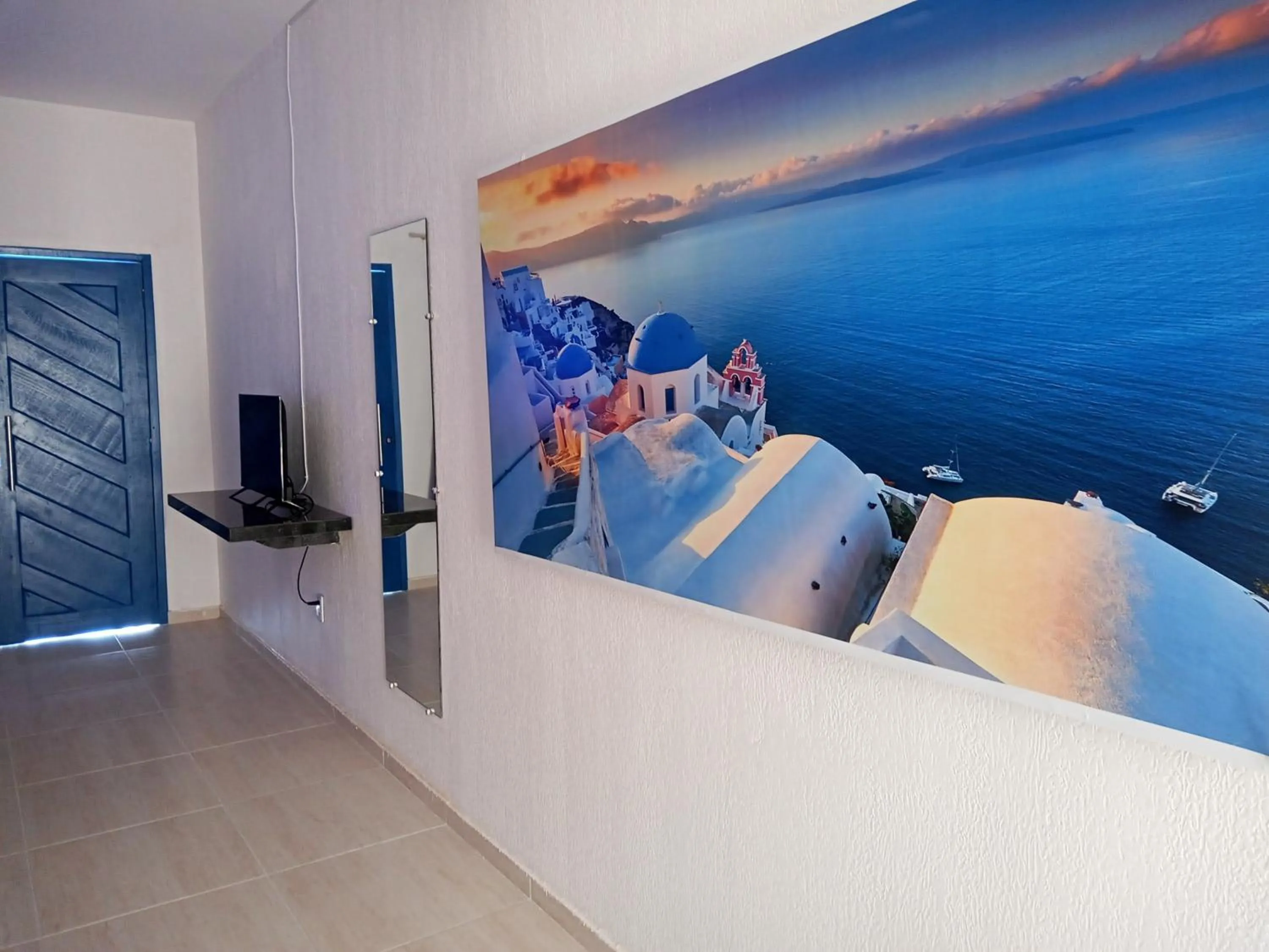 TV and multimedia in La Suite Praia Hotel