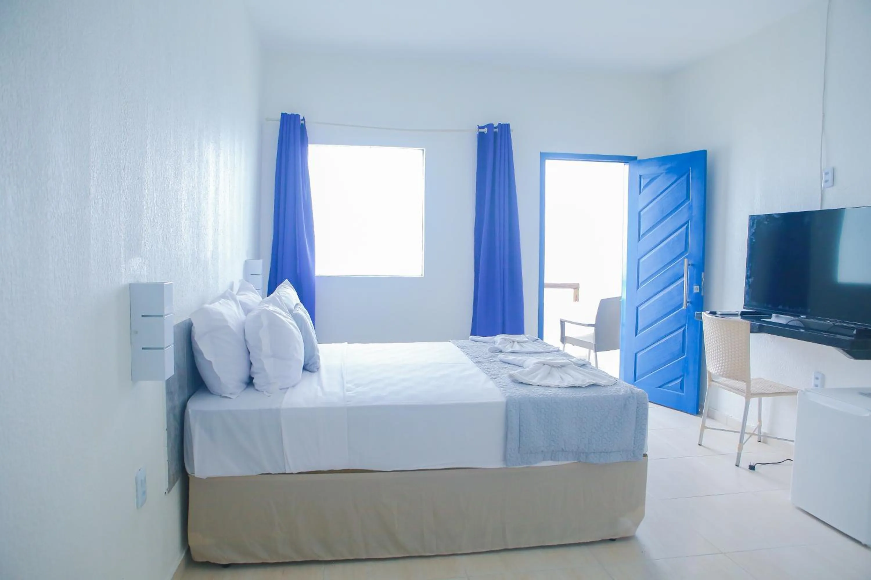 Photo of the whole room, Bed in La Suite Praia Hotel