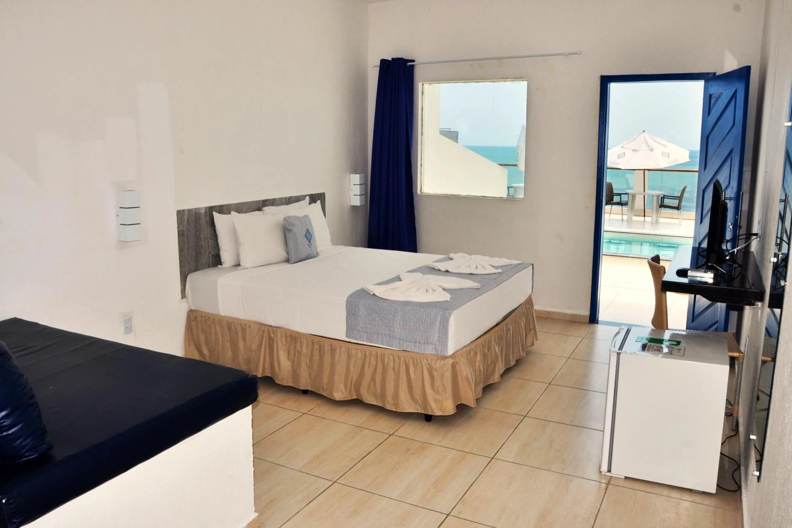 Photo of the whole room, Bed in La Suite Praia Hotel