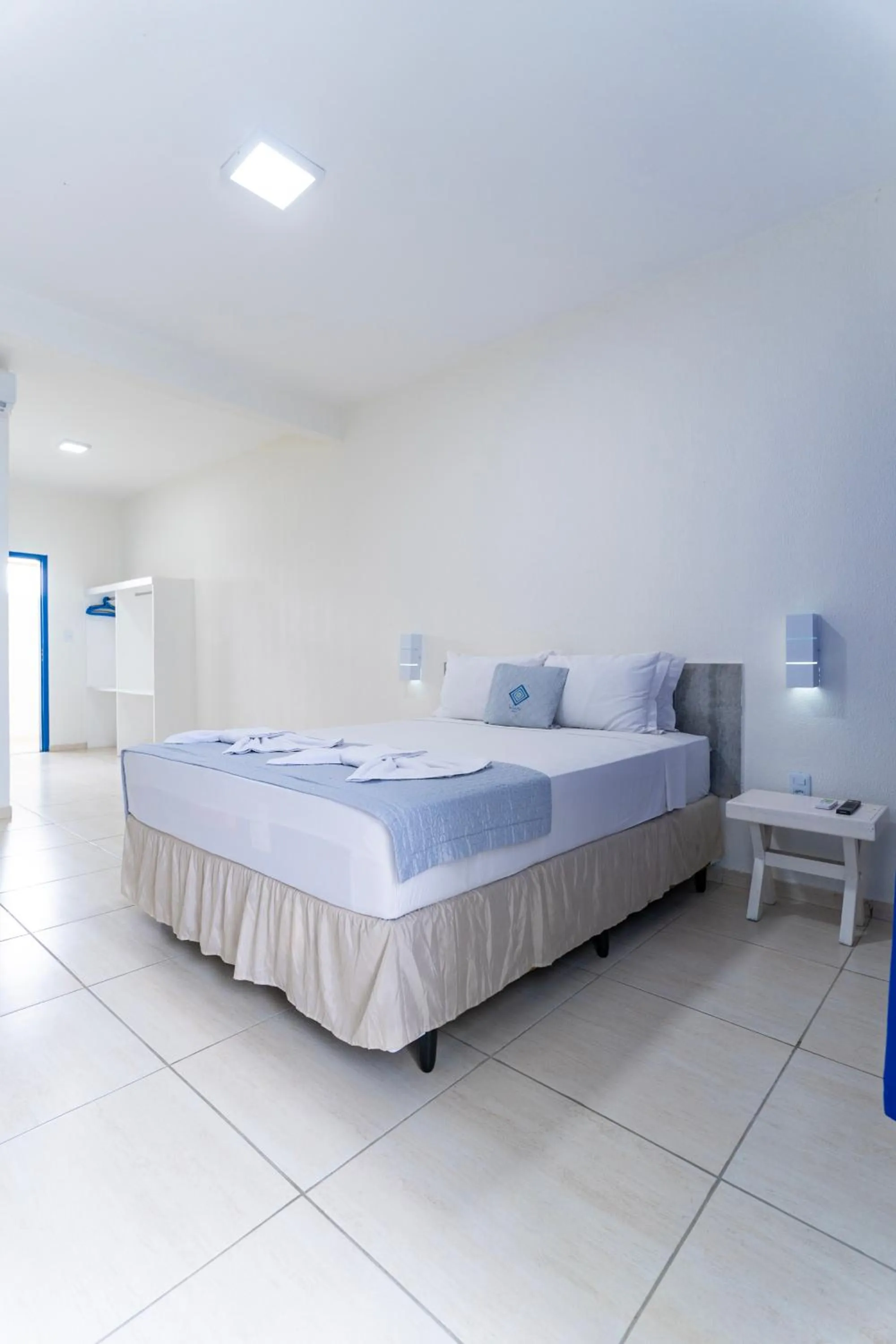 Bed in La Suite Praia Hotel