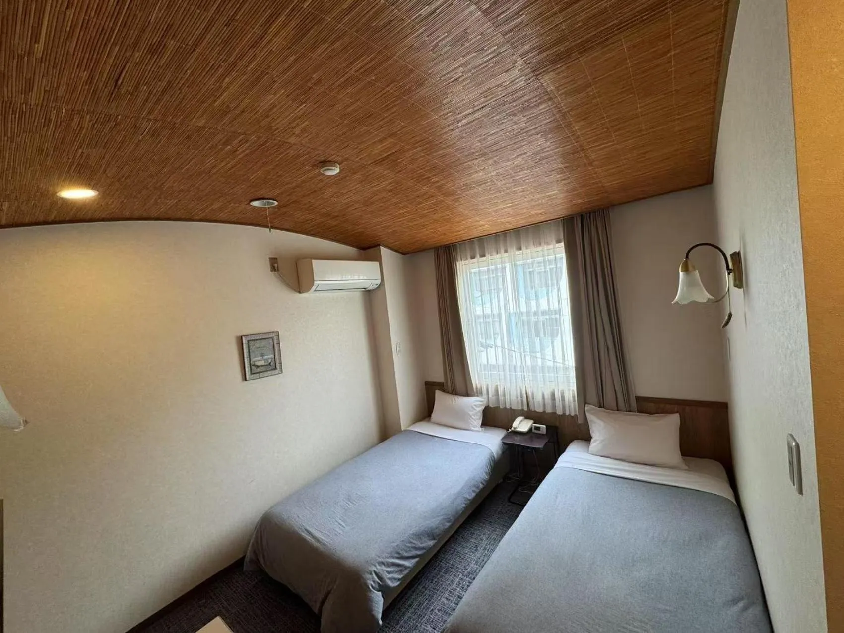 Bed in Shinnishiki Hotel