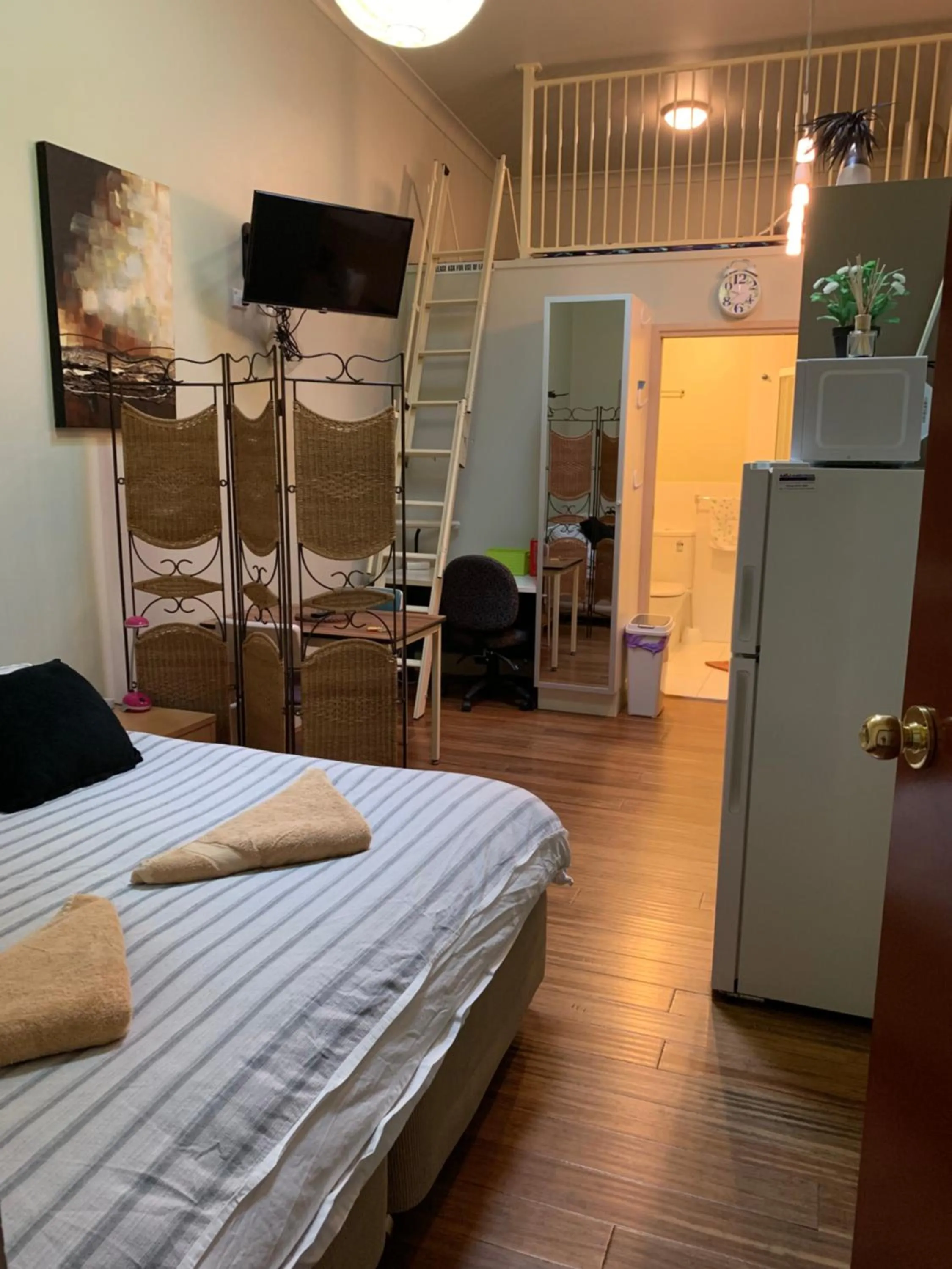 Bed in Westside Studio Apartments