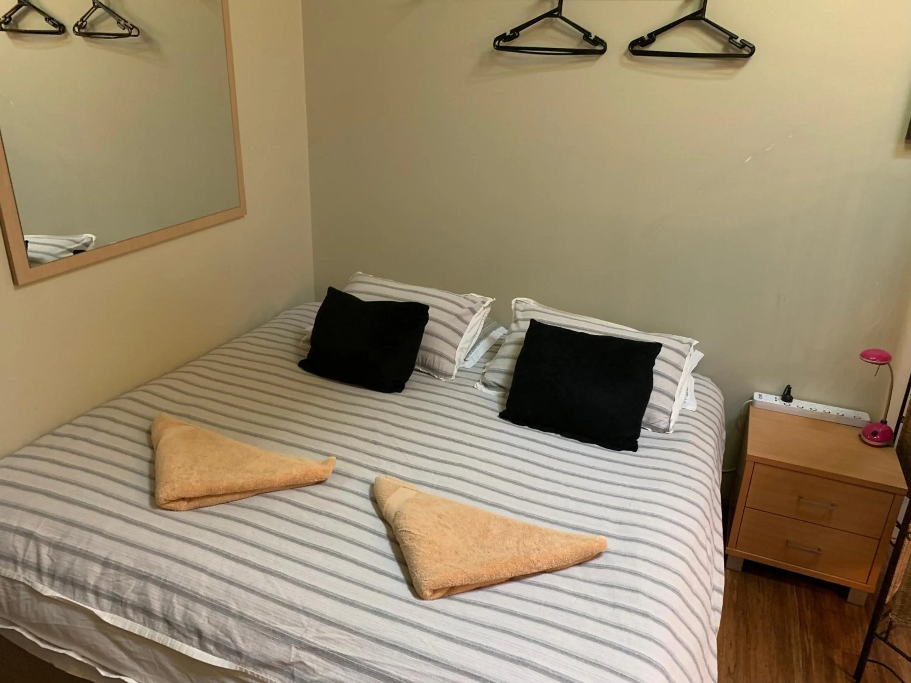 Bed in Westside Studio Apartments