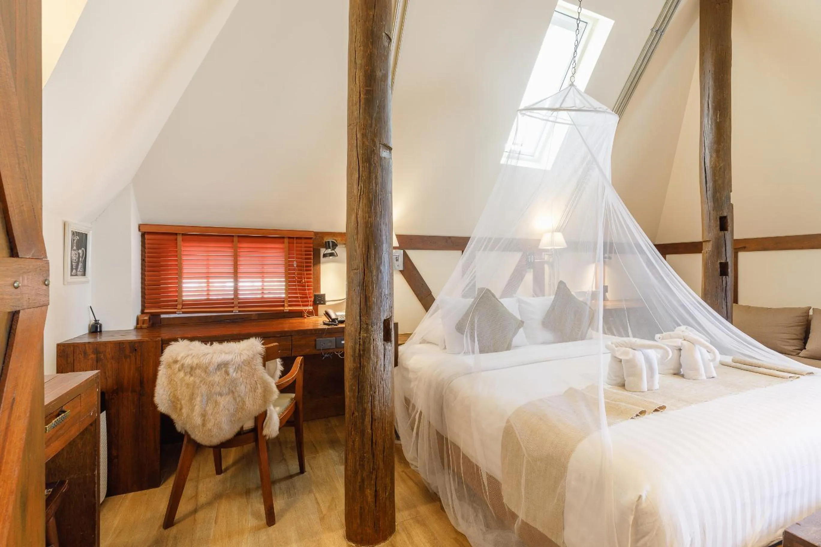 Seating area, Bed in Le Charcoa Hotel