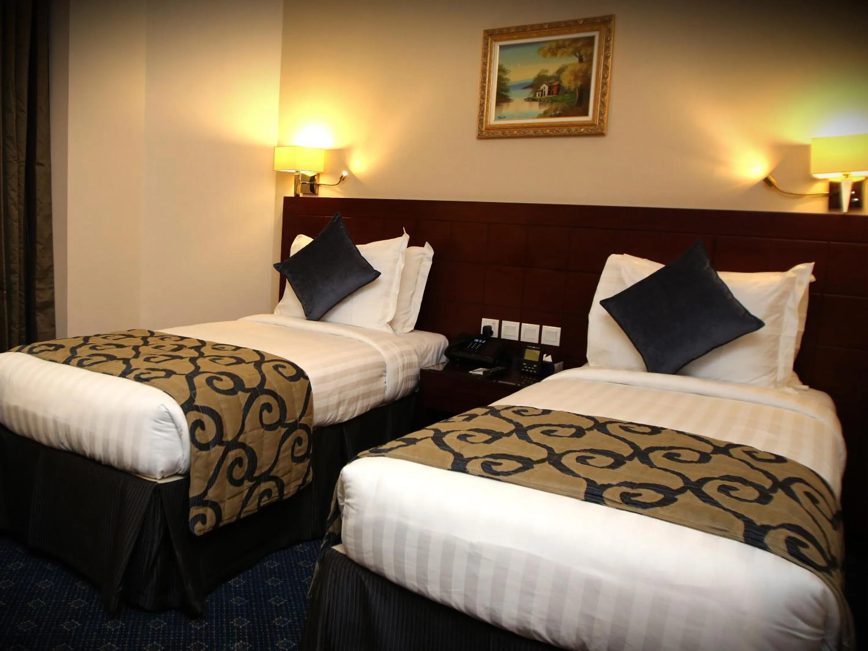 Bed in Al Aqeeq Al Rawda Hotel by Abu Al Joud