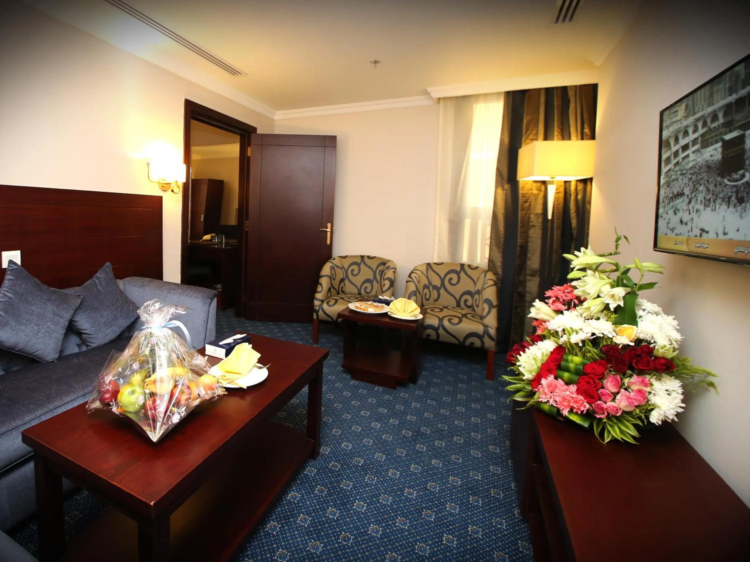 Seating area in Al Aqeeq Al Rawda Hotel by Abu Al Joud