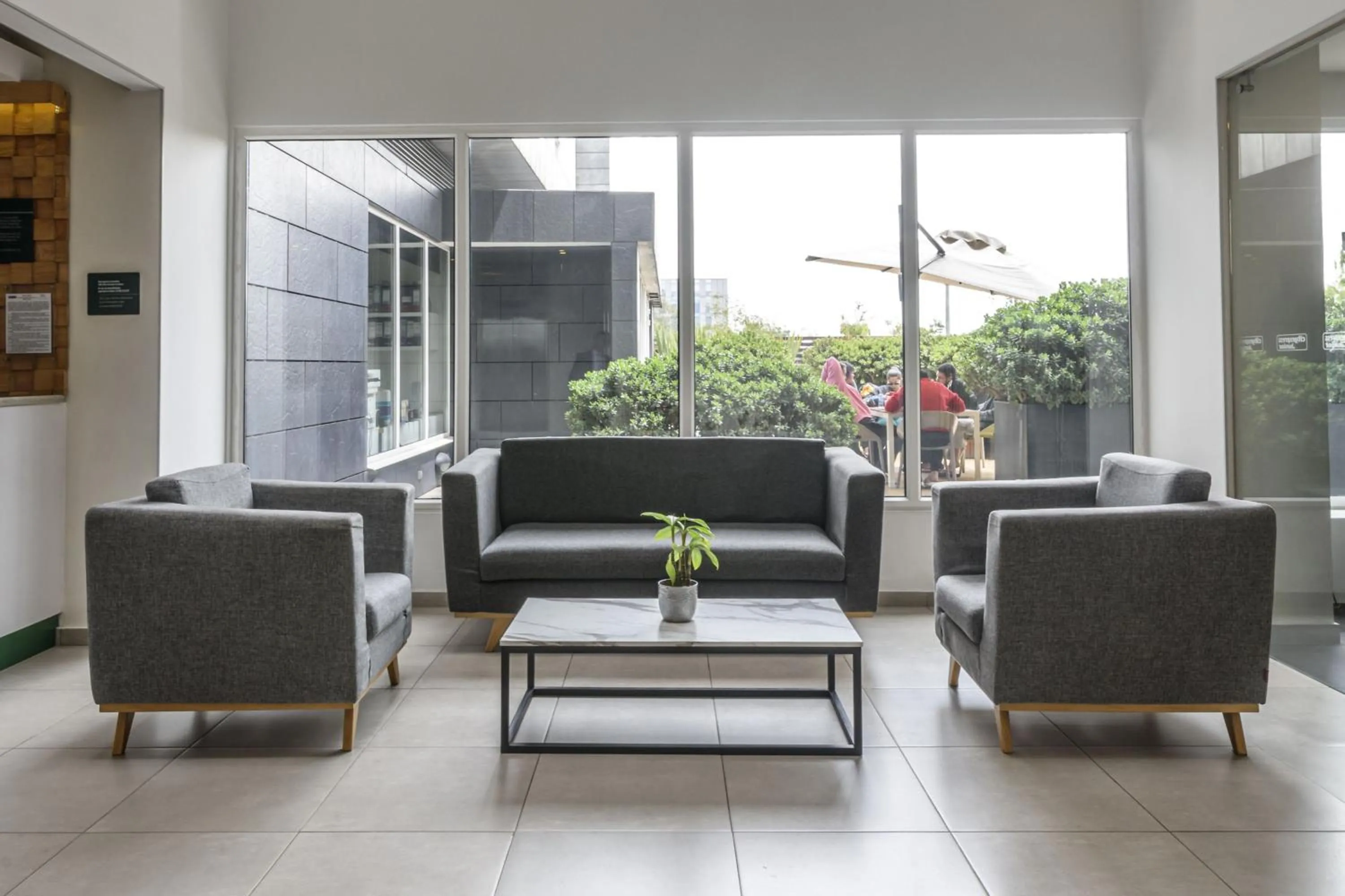 Living room in City Express Junior by Marriott Bogota Aeropuerto