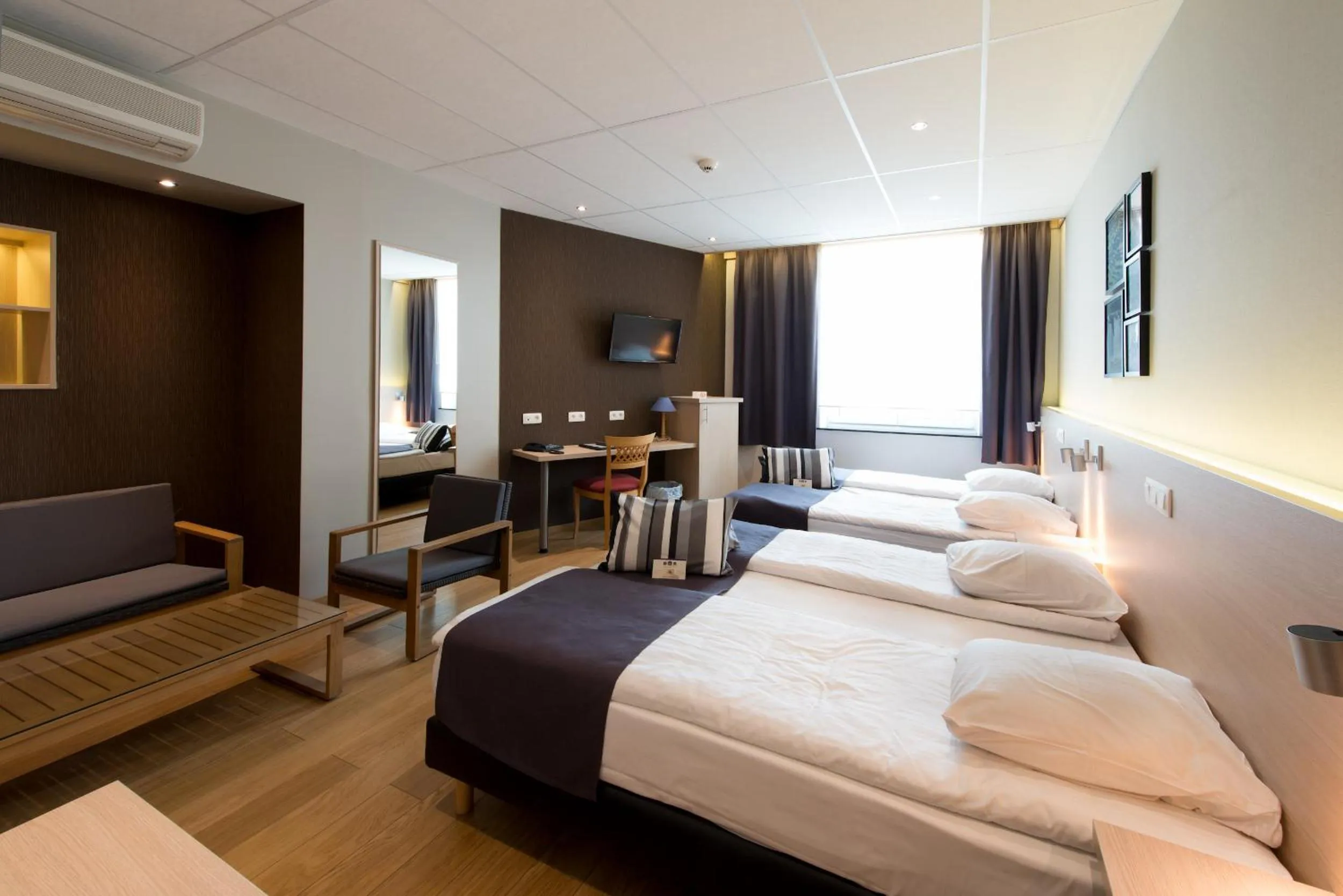 Bed in Hôtel de l'Univers Liège