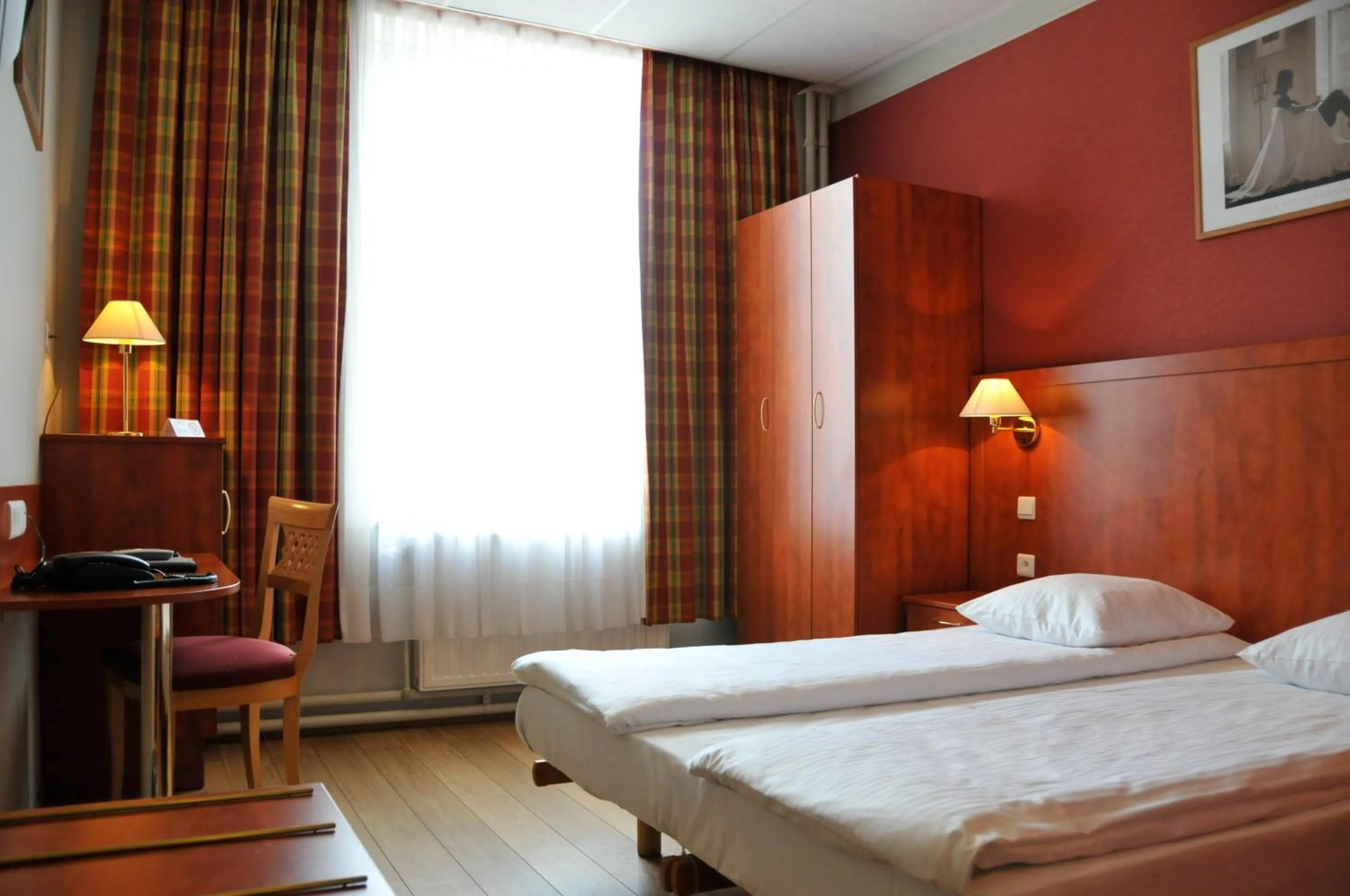 Bed in Hôtel de l'Univers Liège