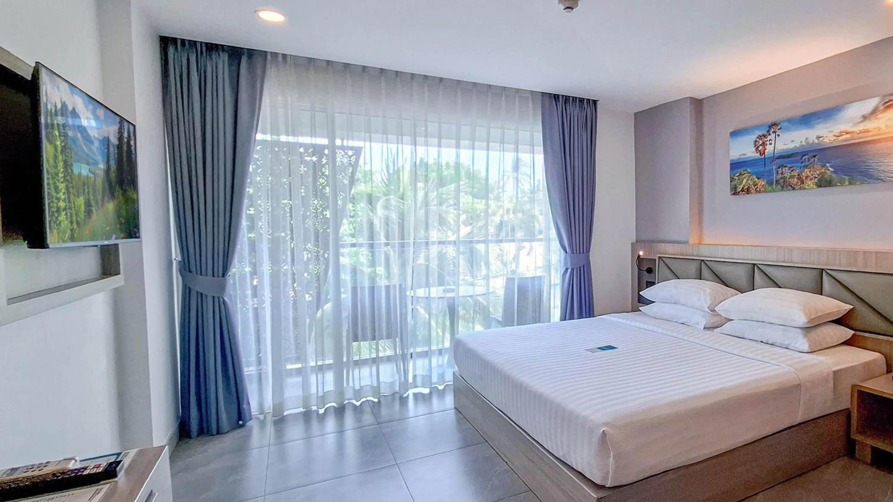 View (from property/room), Bed in Clarian Hotel Beach Patong