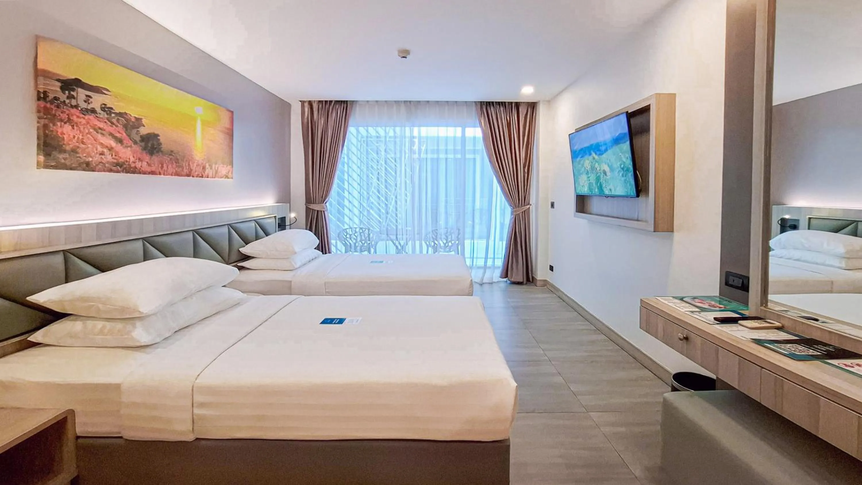 Bed in Clarian Hotel Beach Patong