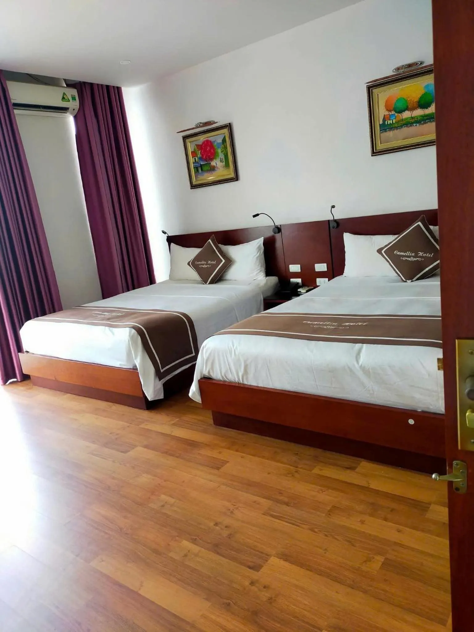 Bed in Camellia Hotel