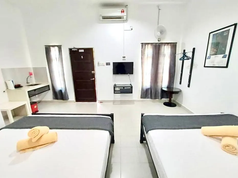 Bed in Belukar Lodges Private Homestay