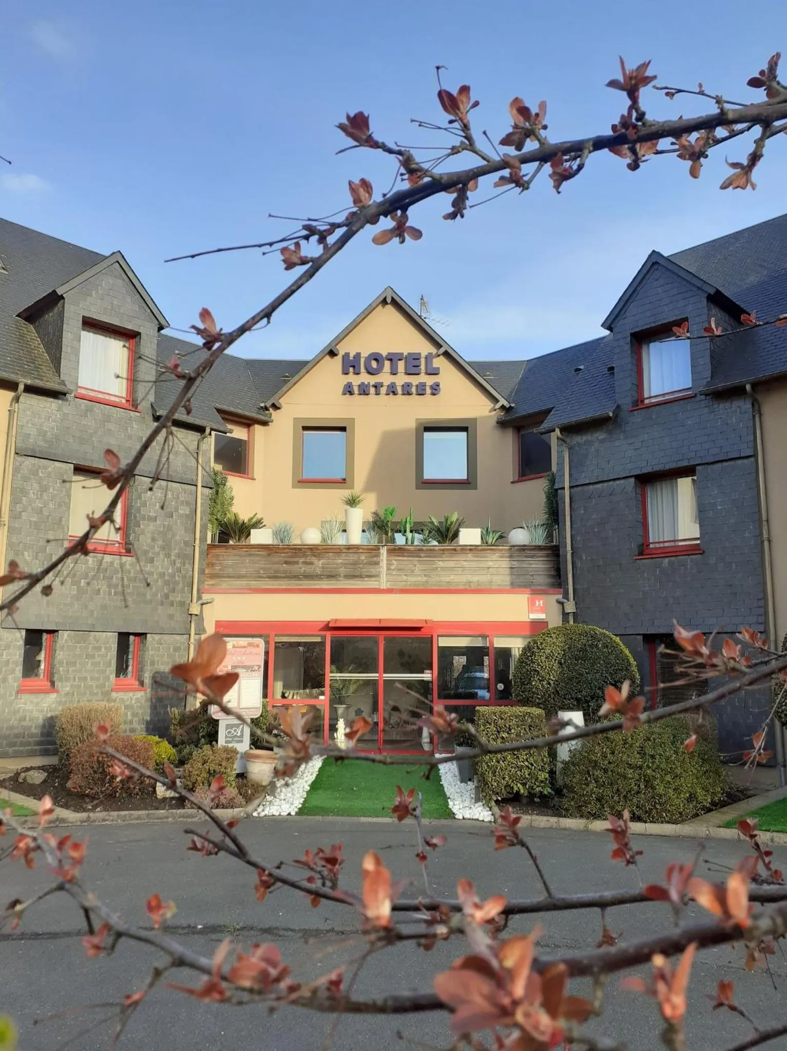 Property building in Hôtel Antares & Spa