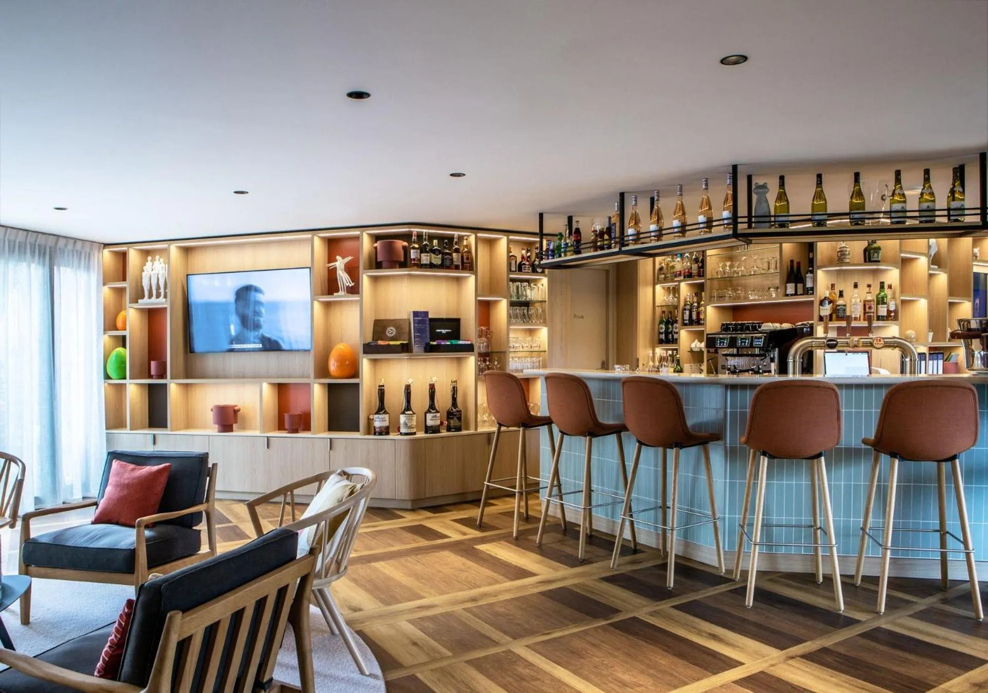 Communal lounge/ TV room in Hôtel Antares & Spa