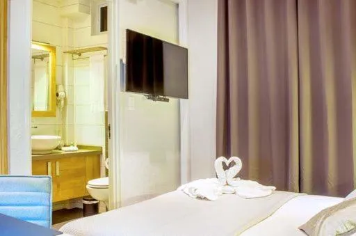 Bed in Q-Inn Boutique Hotel