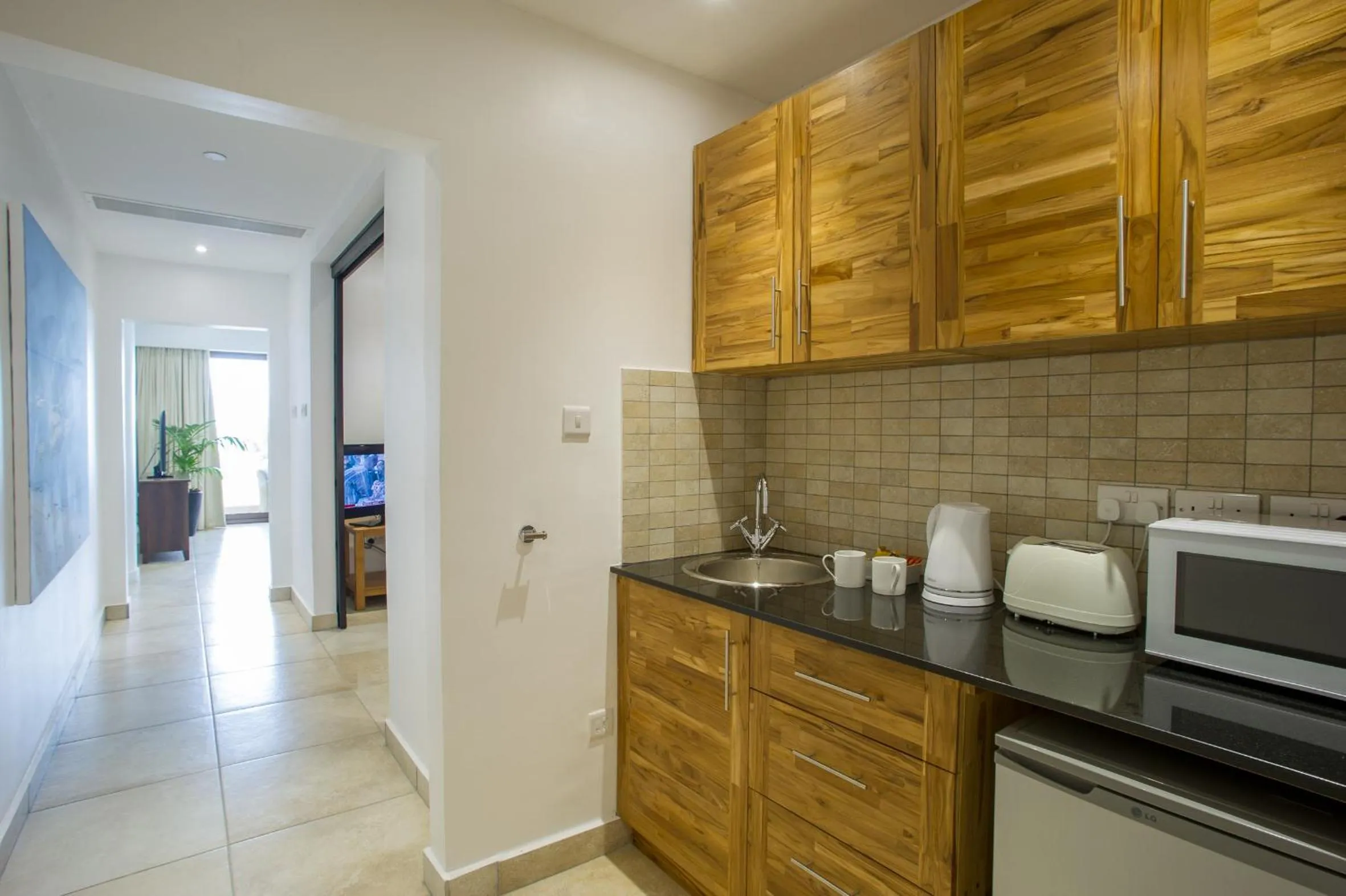 Kitchen or kitchenette in The Oyster Bay Hotel Suites