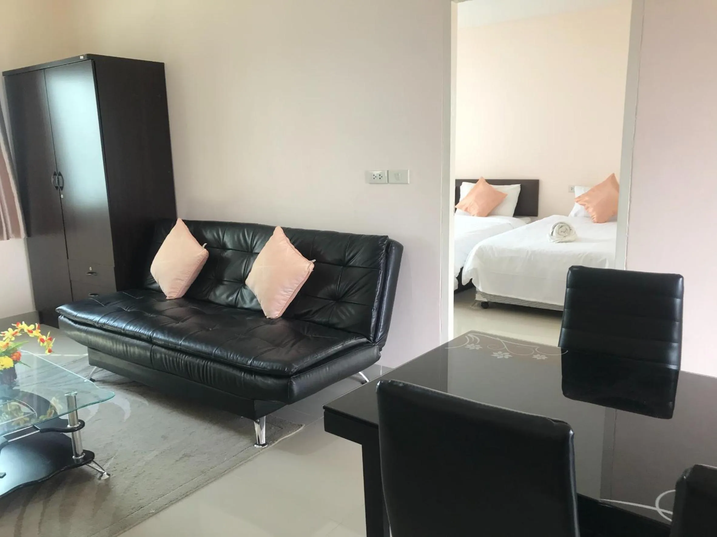 Living room, Bed in Connect Apartment